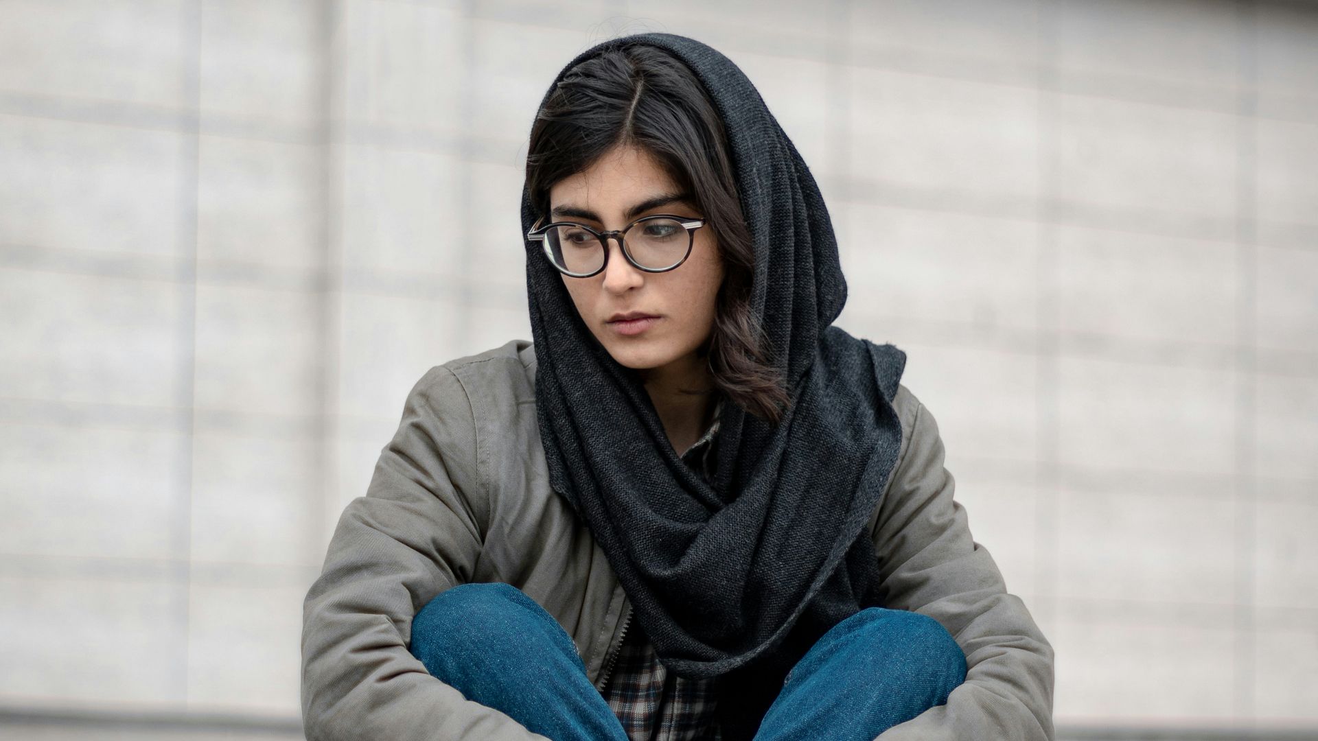 woman in blue denim jacket and black hijab