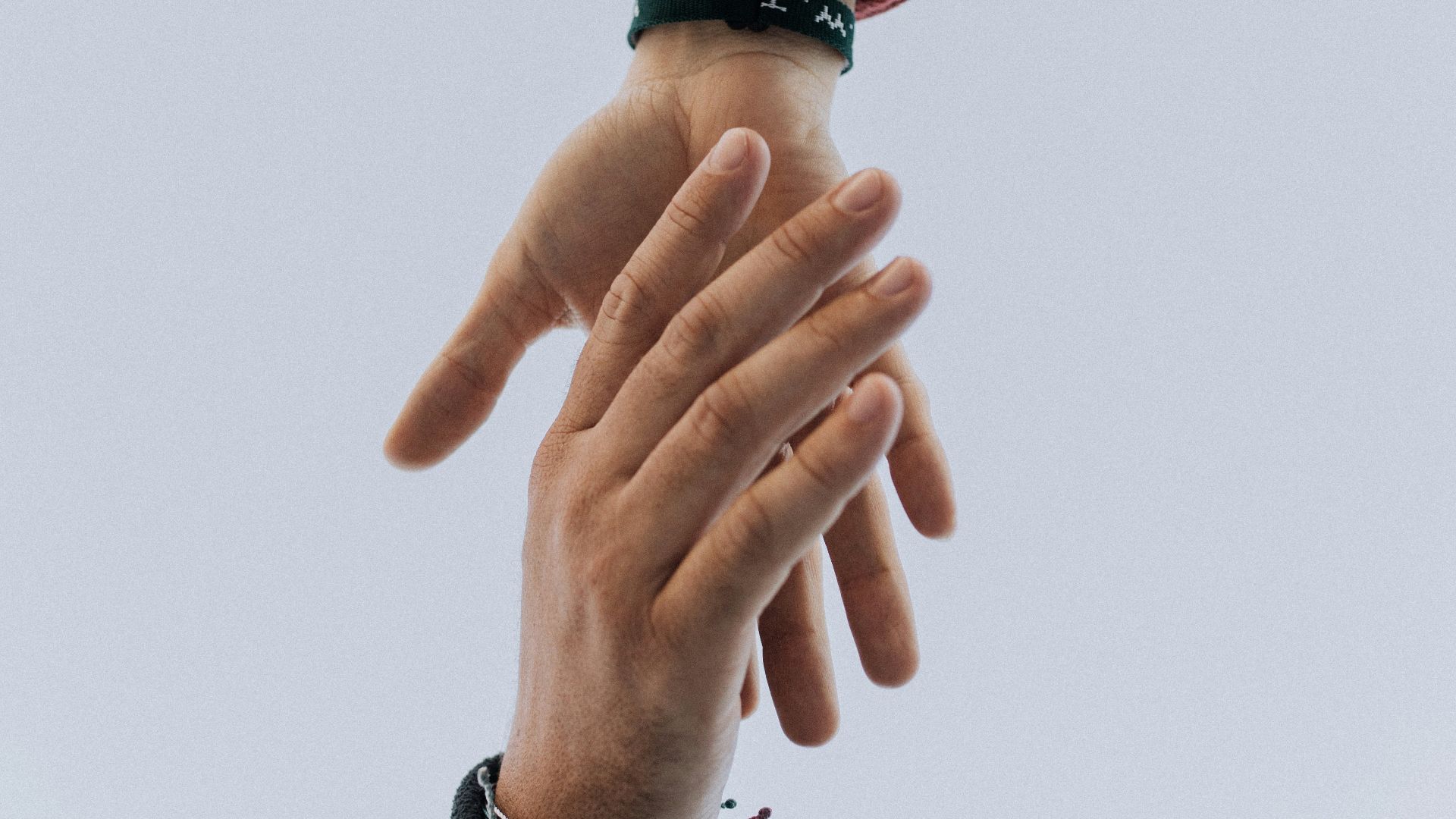 view of two persons hands