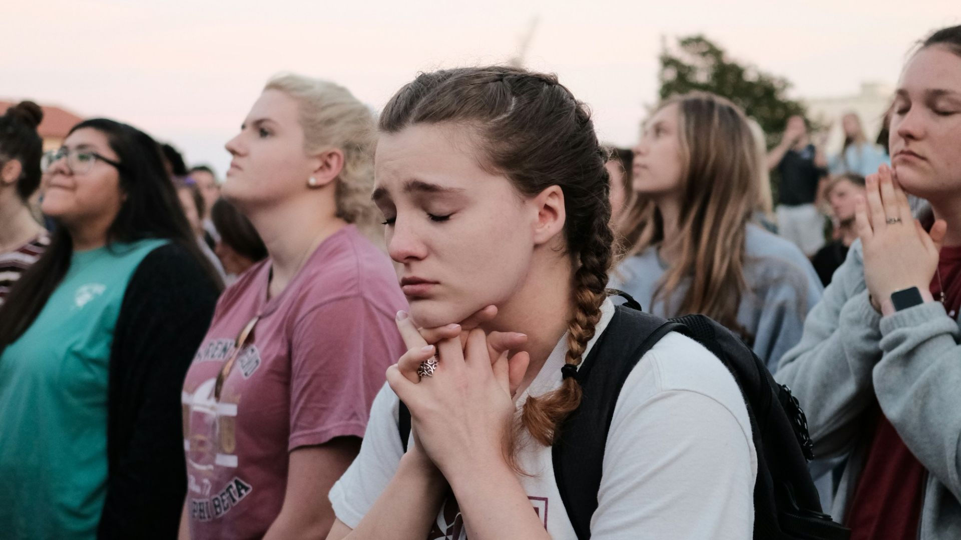 group of woman standing on focus photography