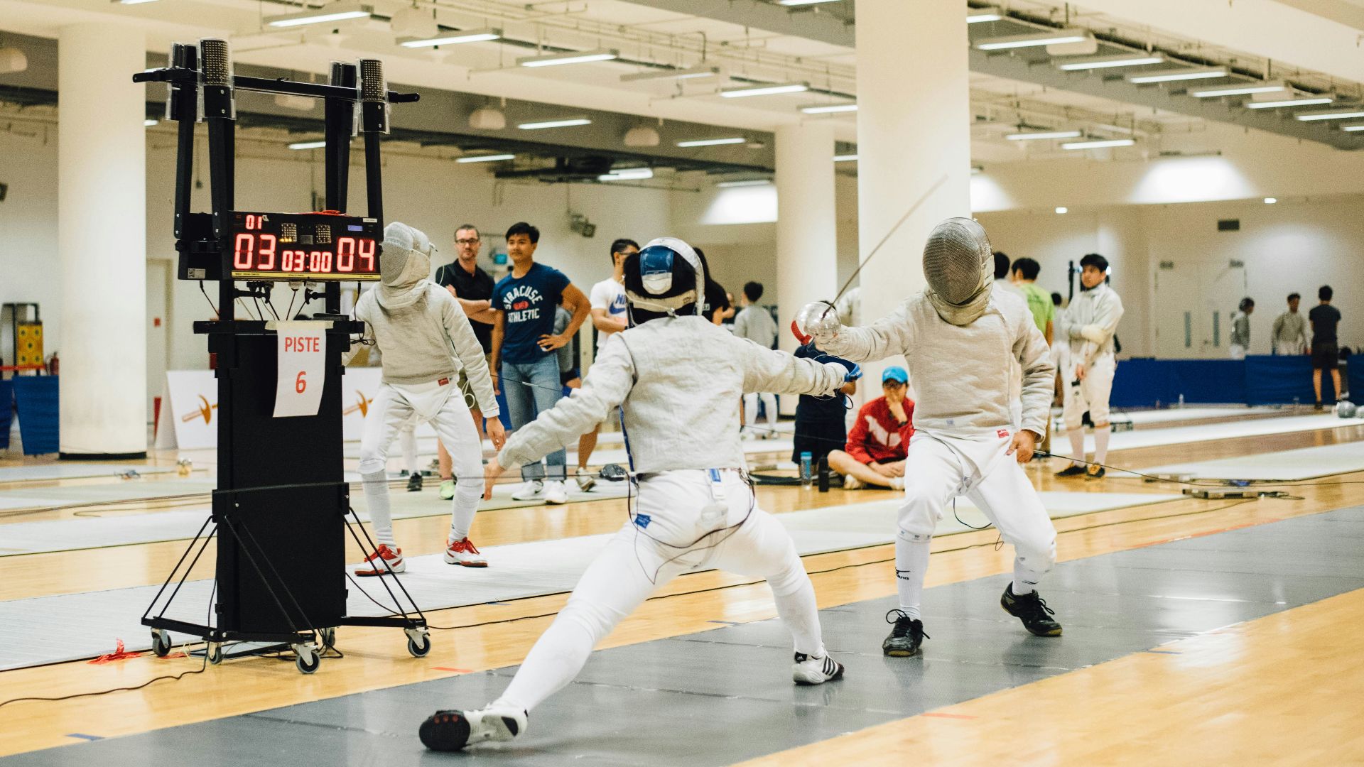 two person wearing white suit doing fencing