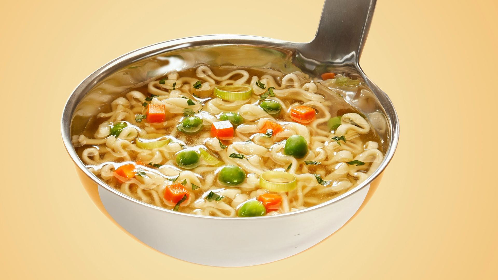 silver steel scoop with noodles