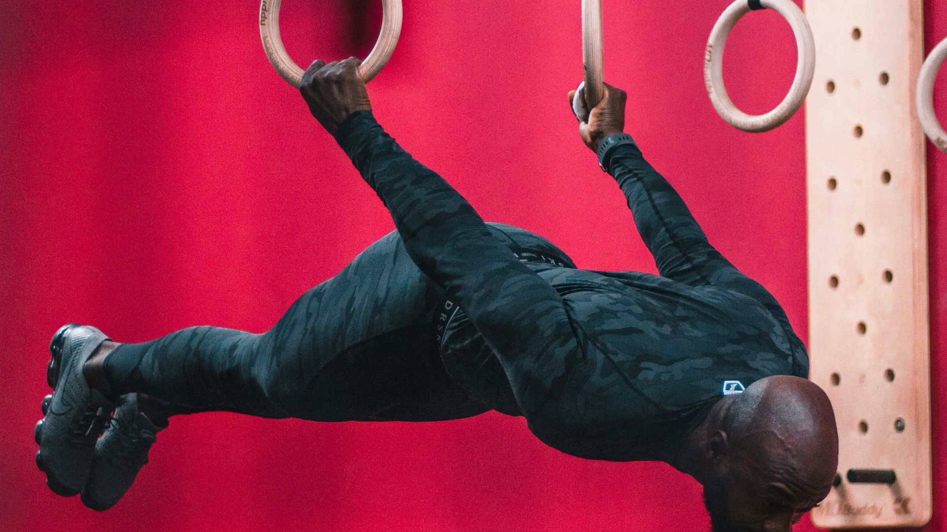 man acrobat on two ring hoops