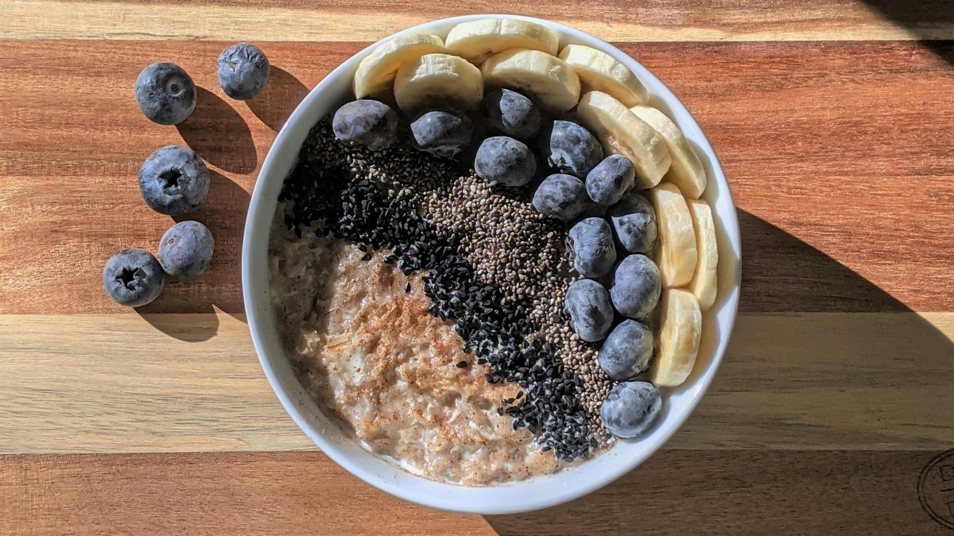 brown and black beans in white ceramic bowl