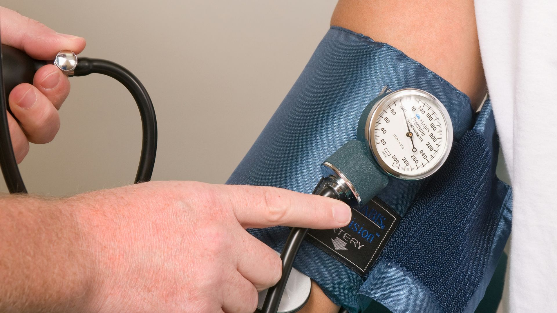 a doctor checking the blood pressure of a patient