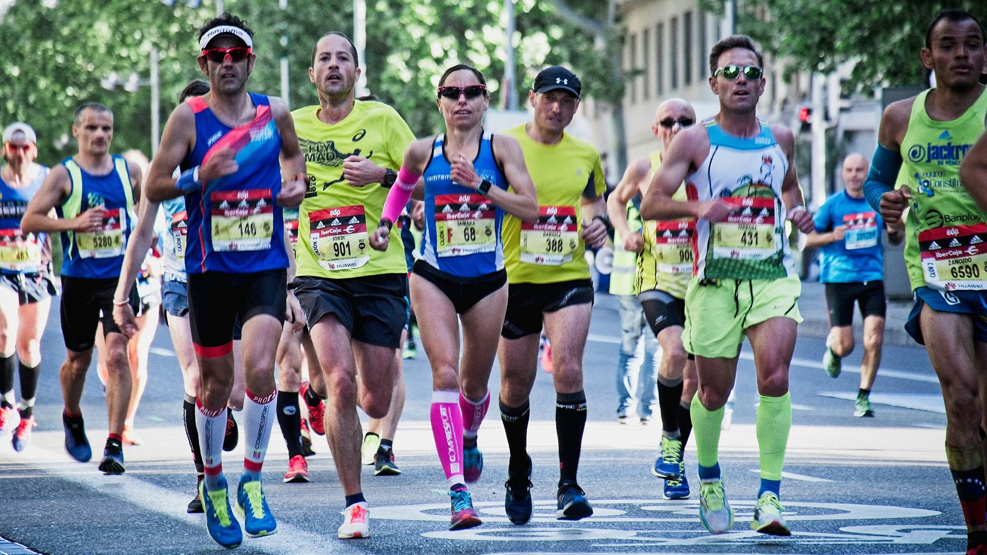 group of people running on the street