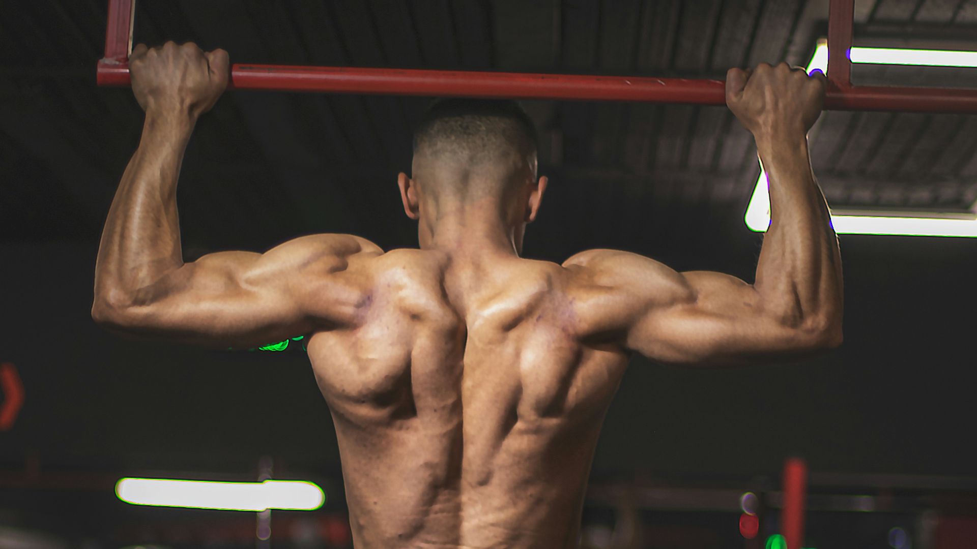 topless man in black shorts