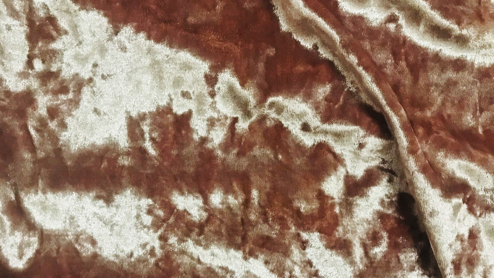 brown and white floral textile