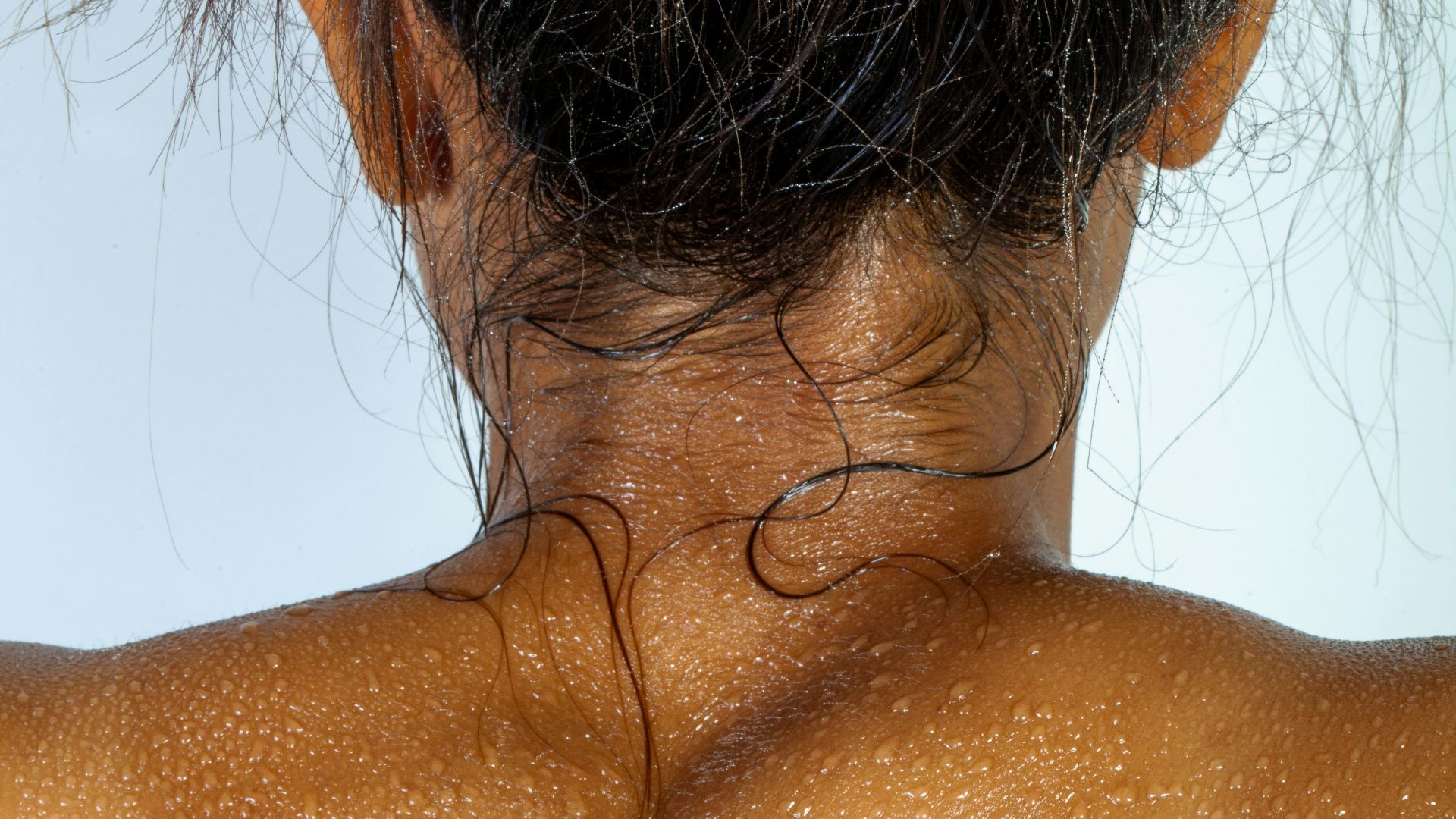 topless woman with brown hair