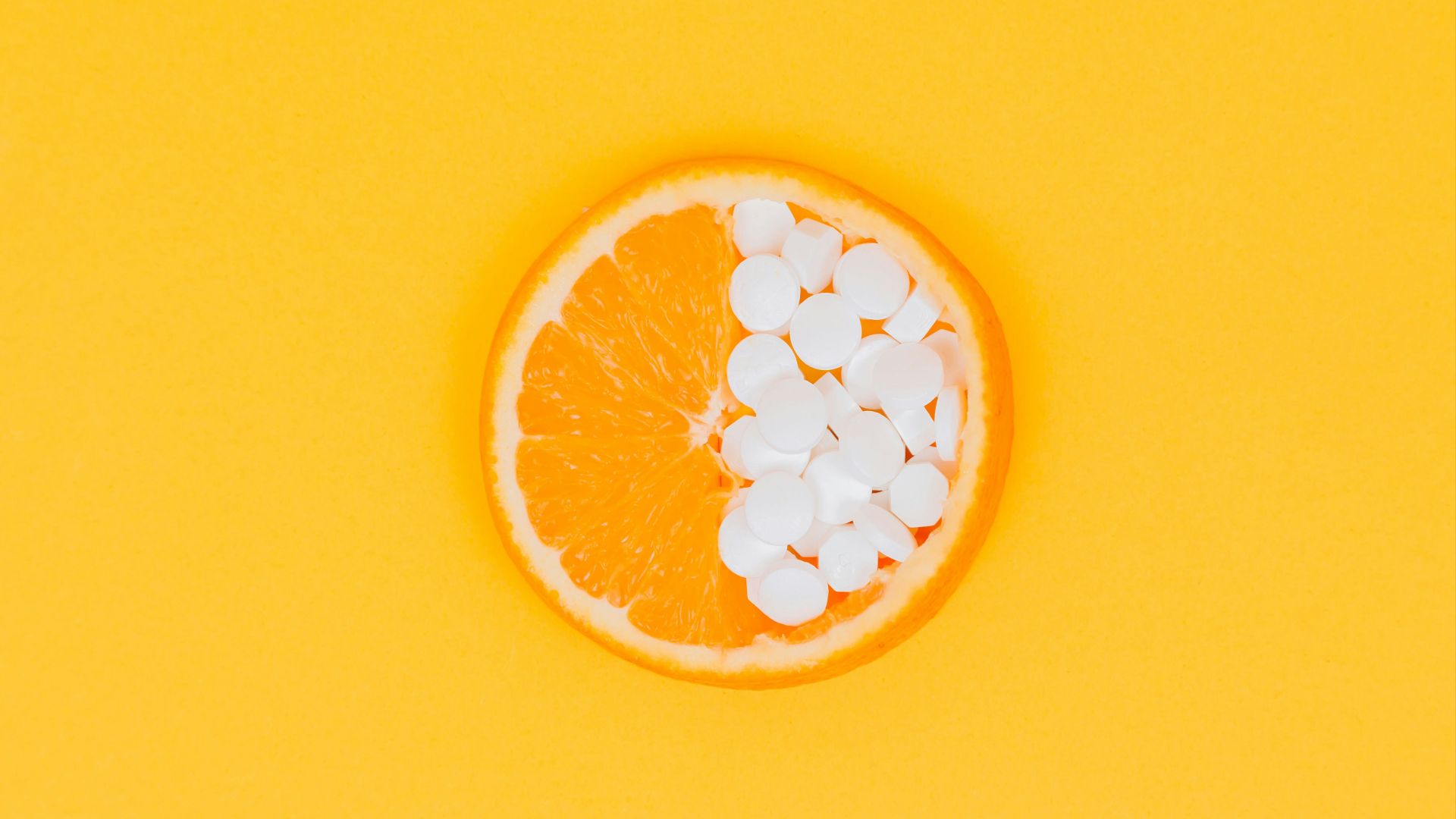orange fruit slices on yellow surface