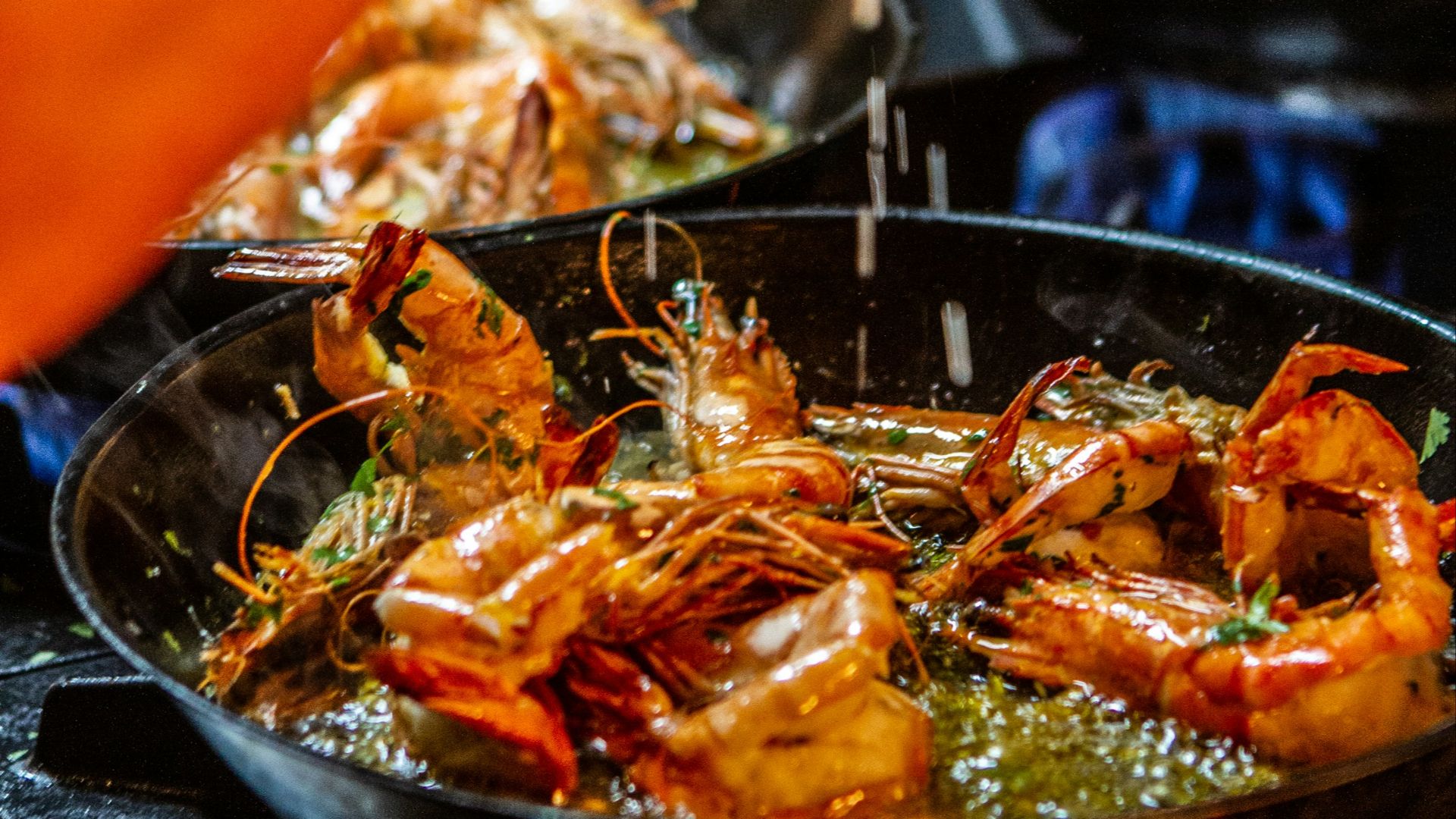 person holding stainless steel tray with cooked food
