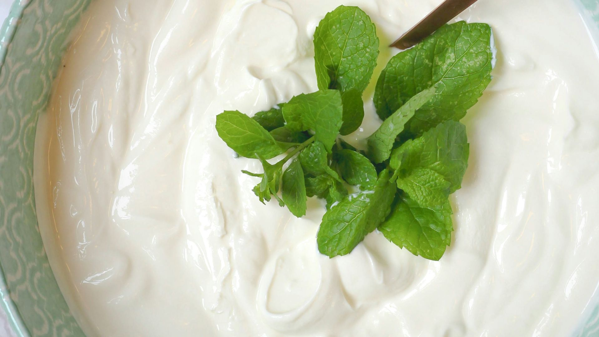a bowl of yogurt with a spoon in it
