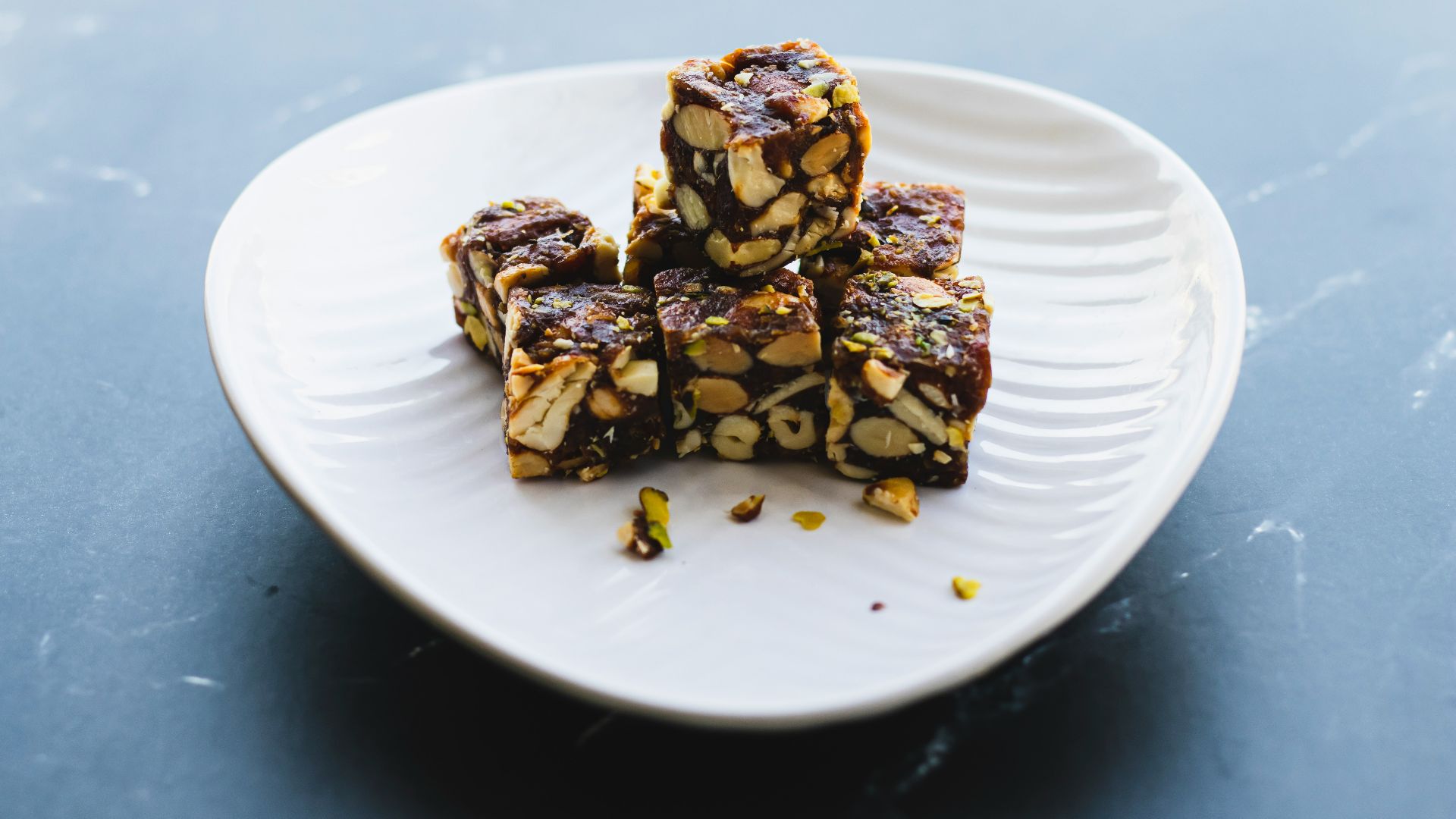 a white plate topped with pieces of food