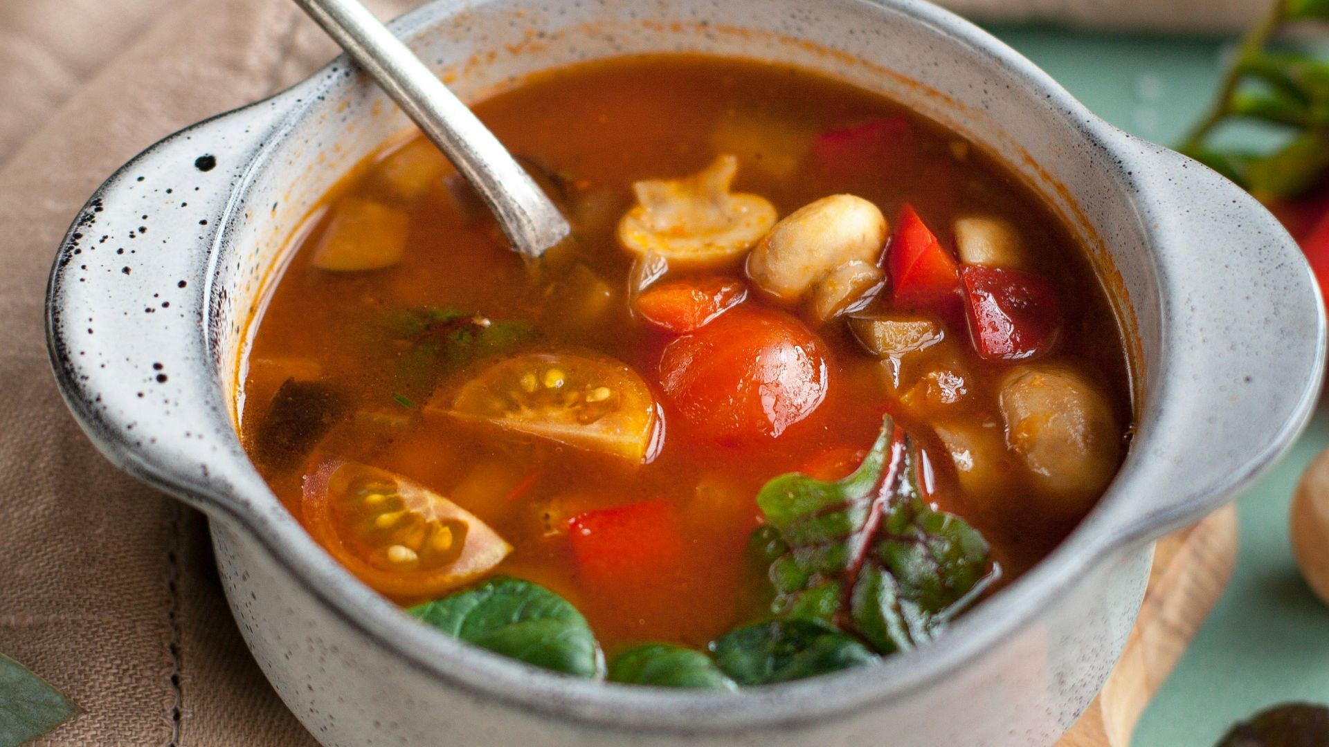 stainless steel spoon on white ceramic bowl