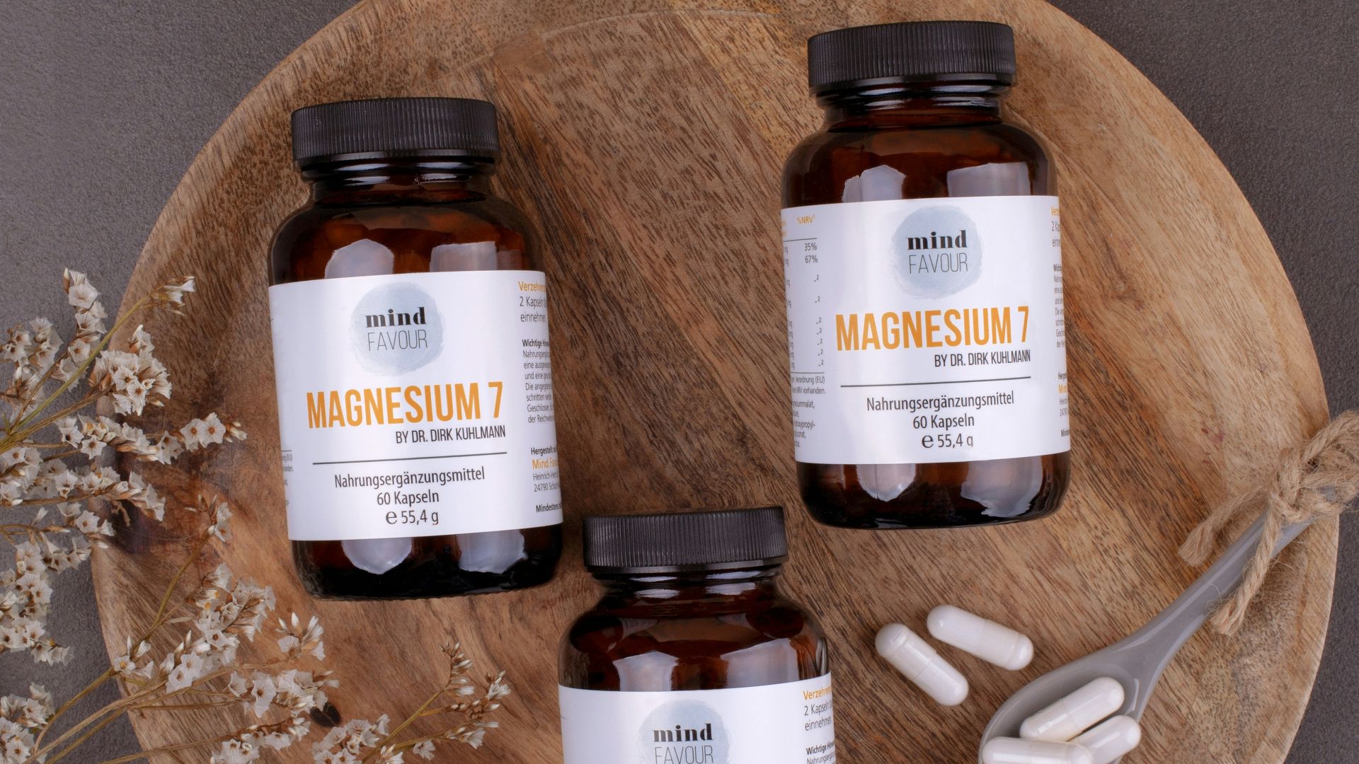 three bottles of magnesum on a wooden plate