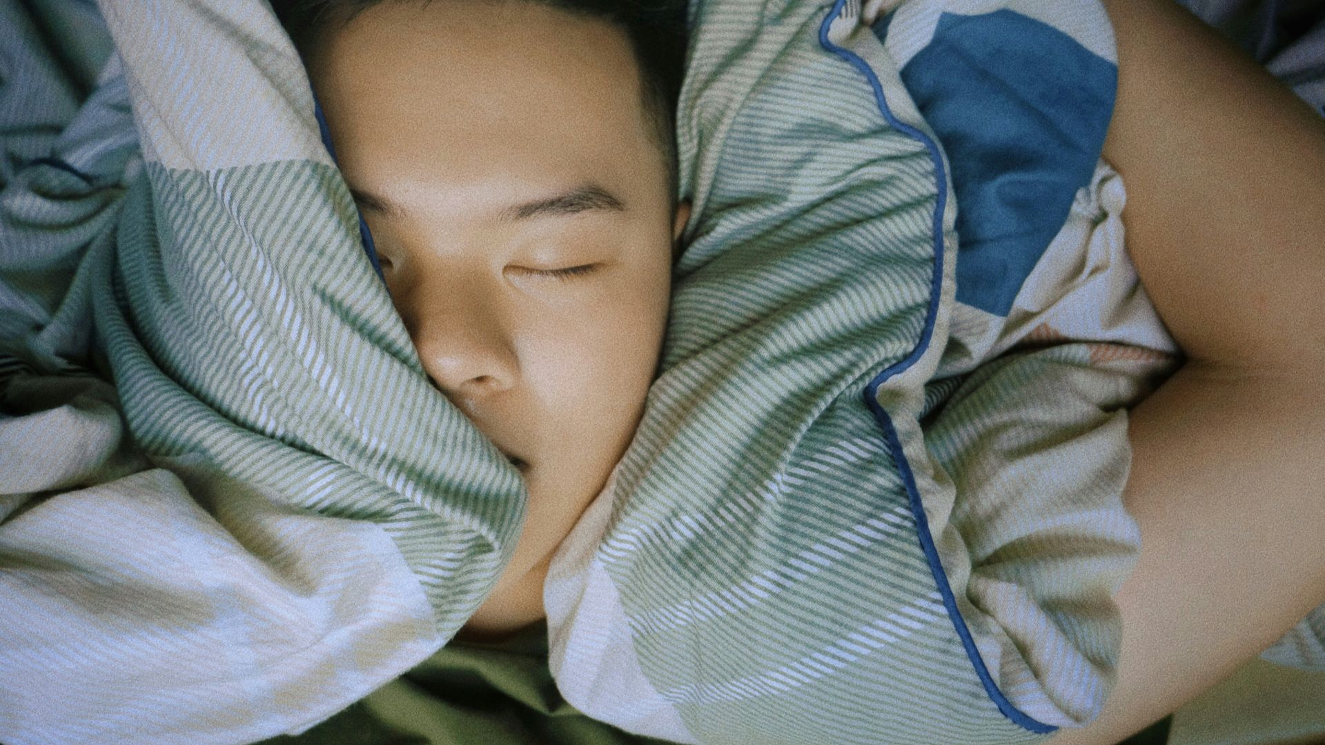 baby in blue and white stripe onesie