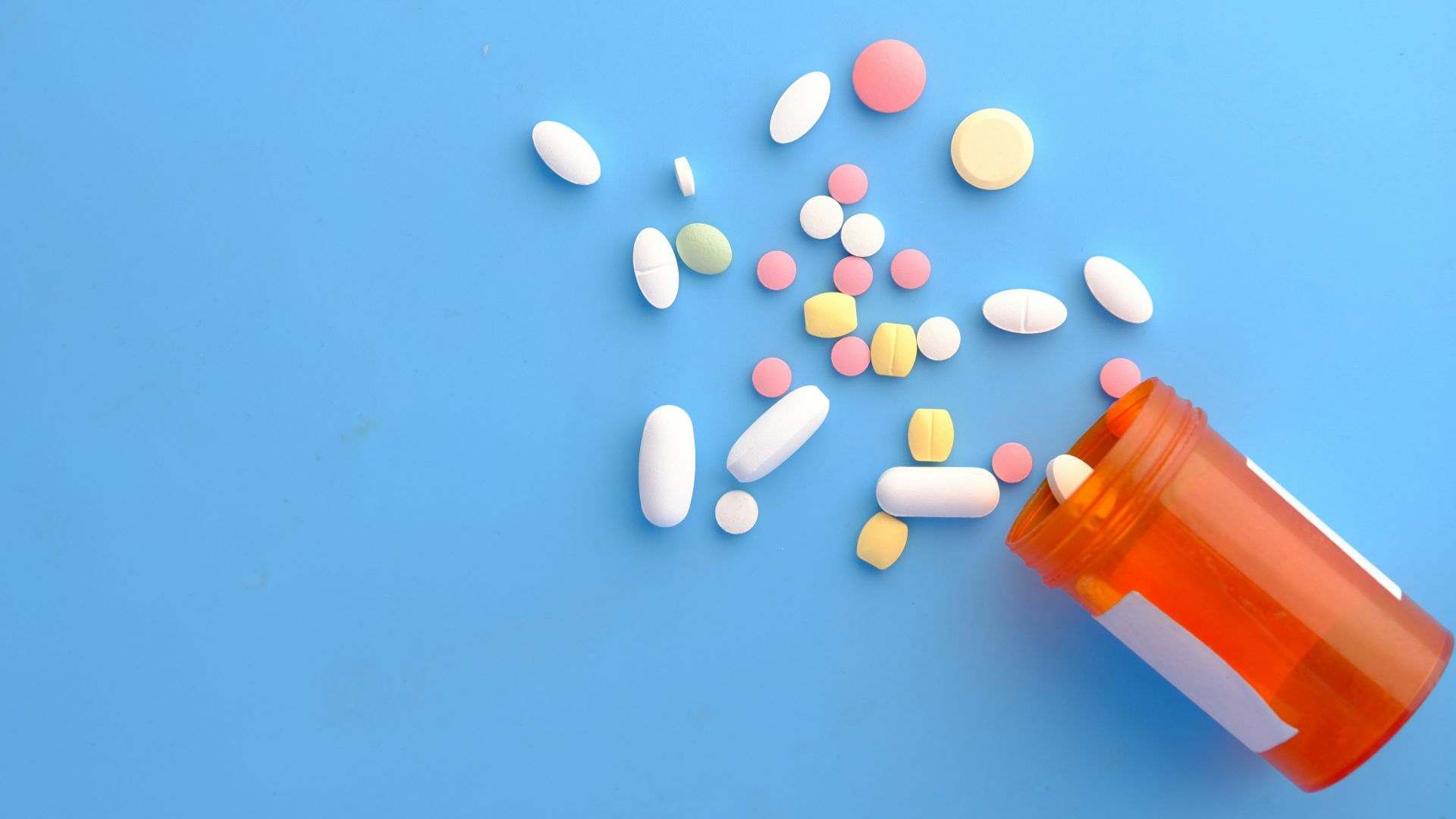 orange and white medication pill