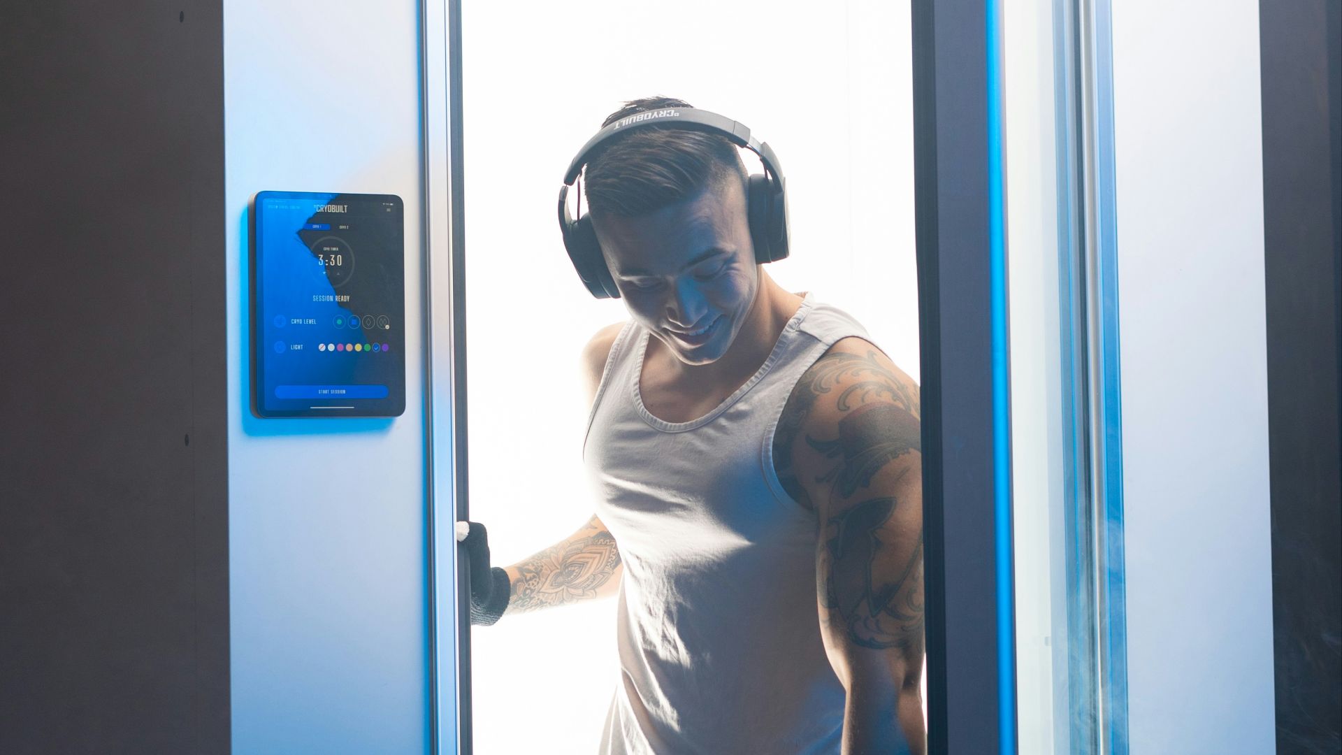 man in white long sleeve shirt wearing white goggles standing beside blue door