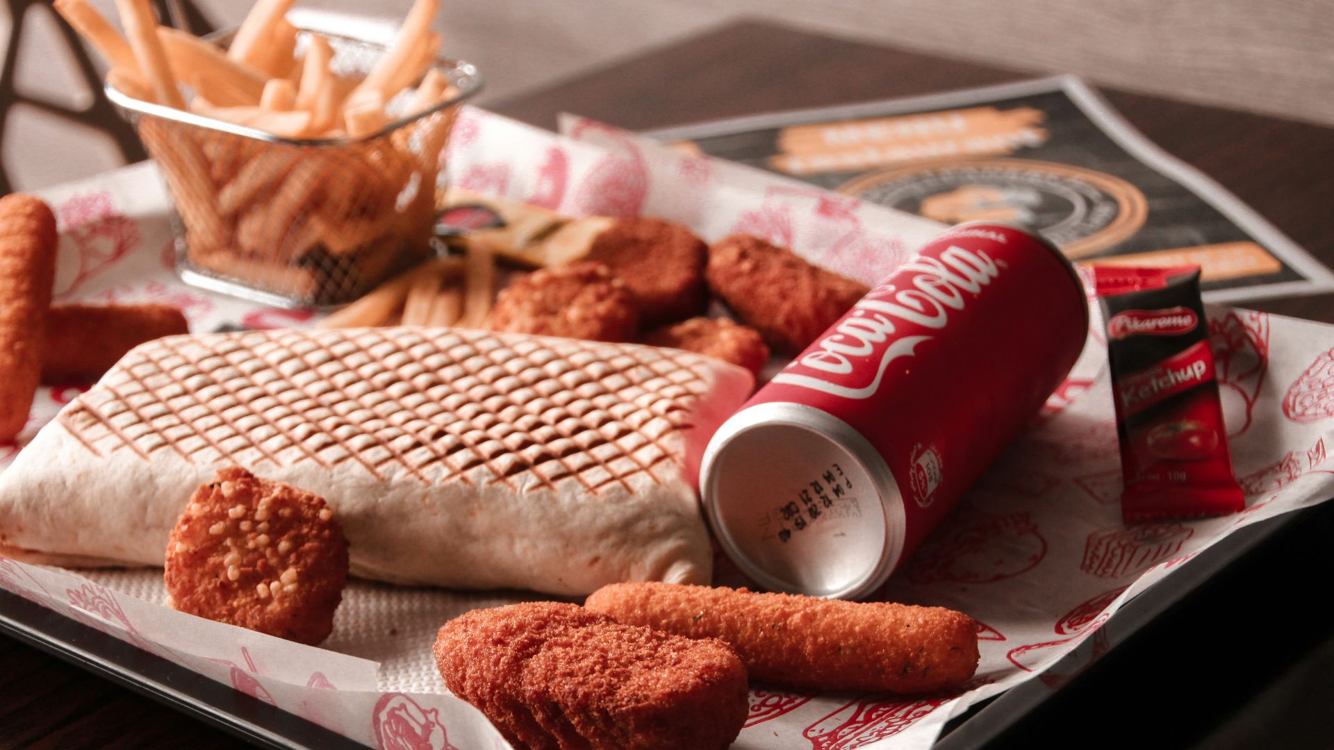 red and white coca cola can beside brown bread on white ceramic plate