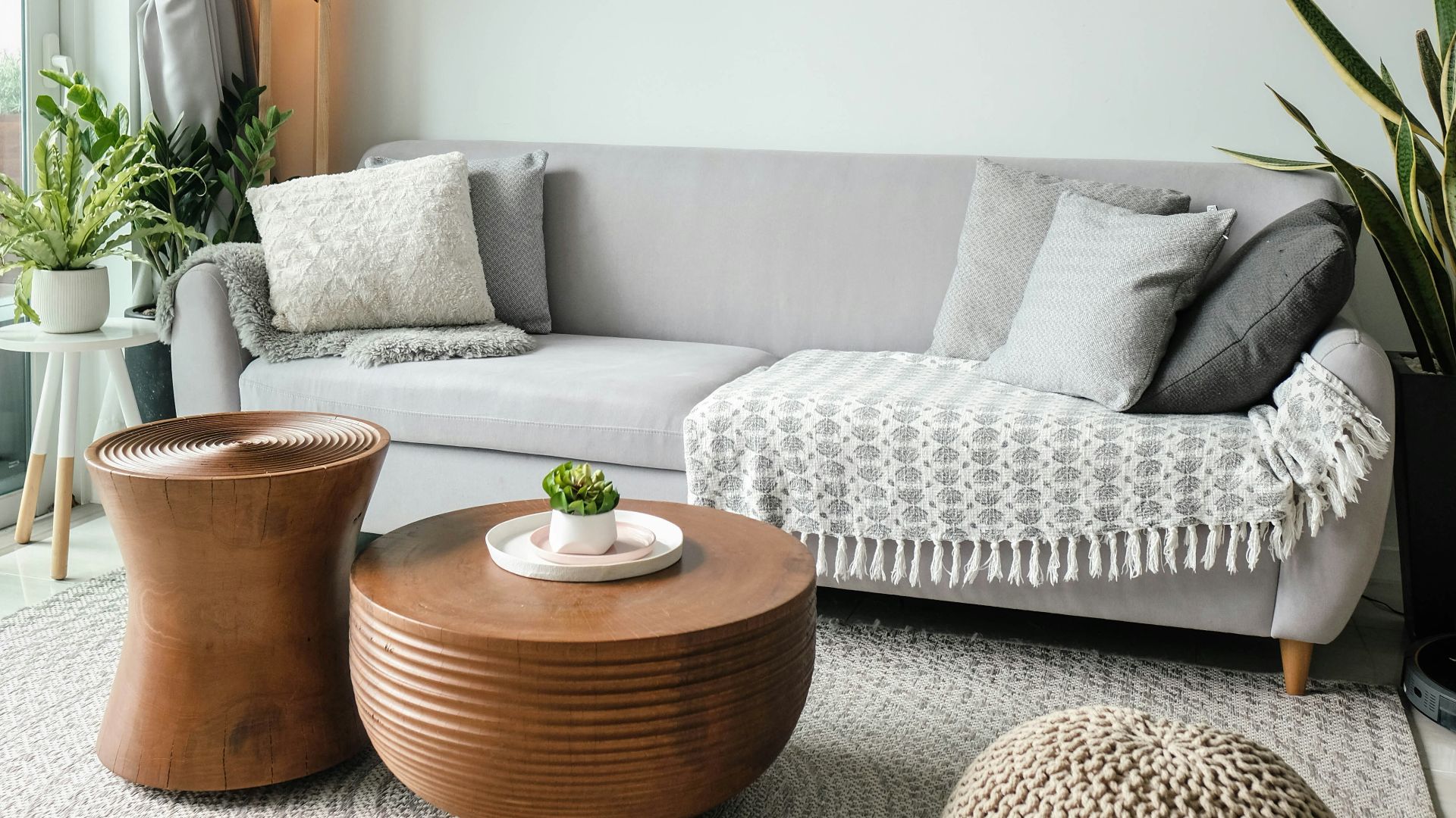 a living room filled with furniture and a large window