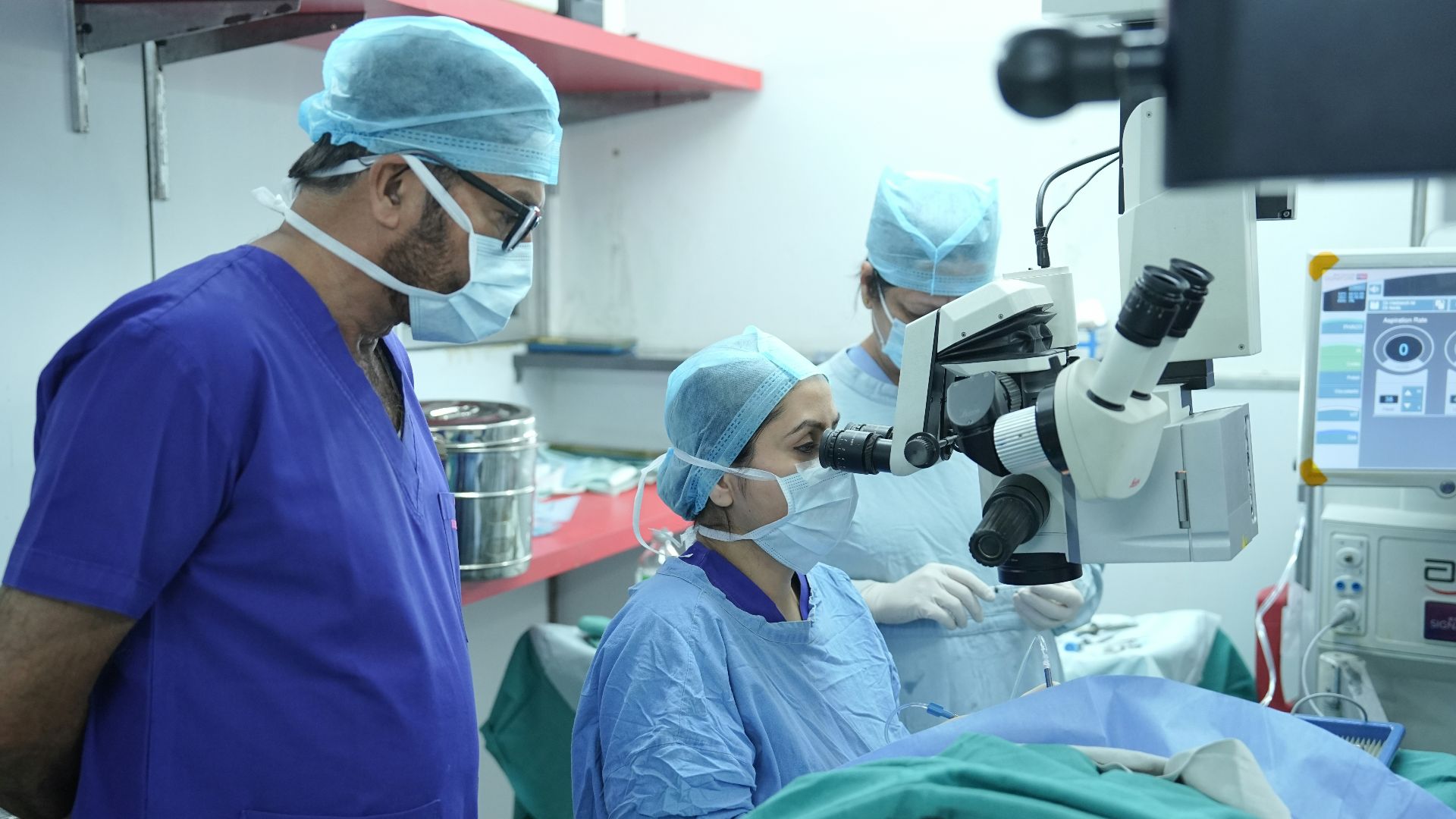 Doctors are performing surgery in an operating room.