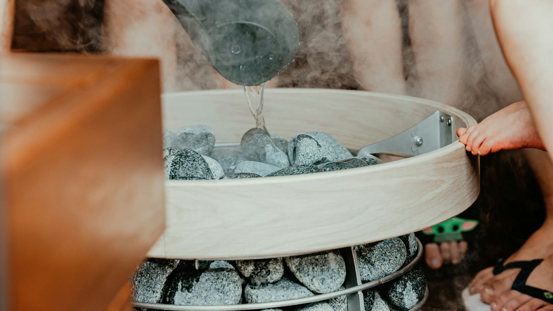 a person pouring water into a glass