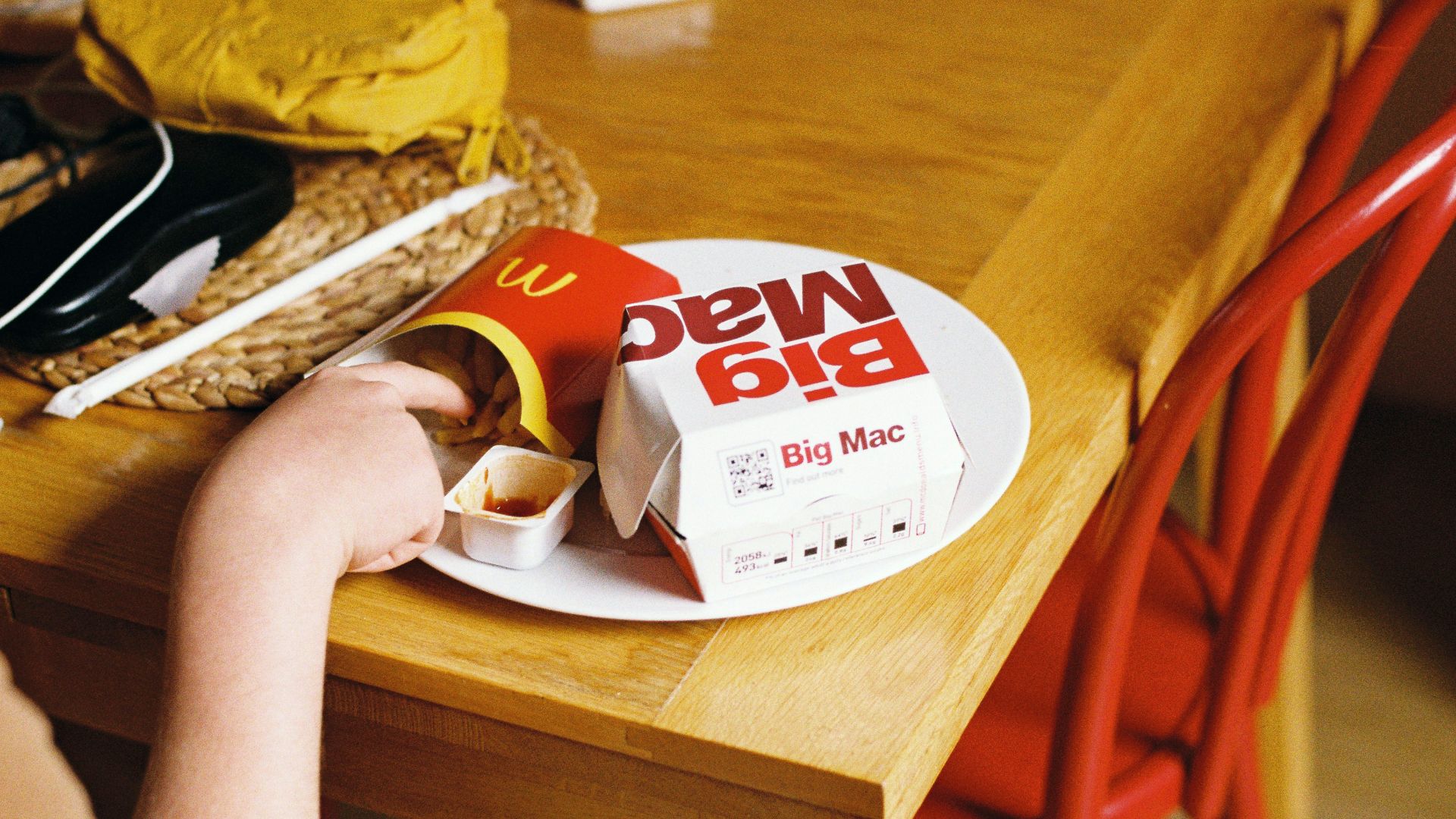 a person holding a box of cookies
