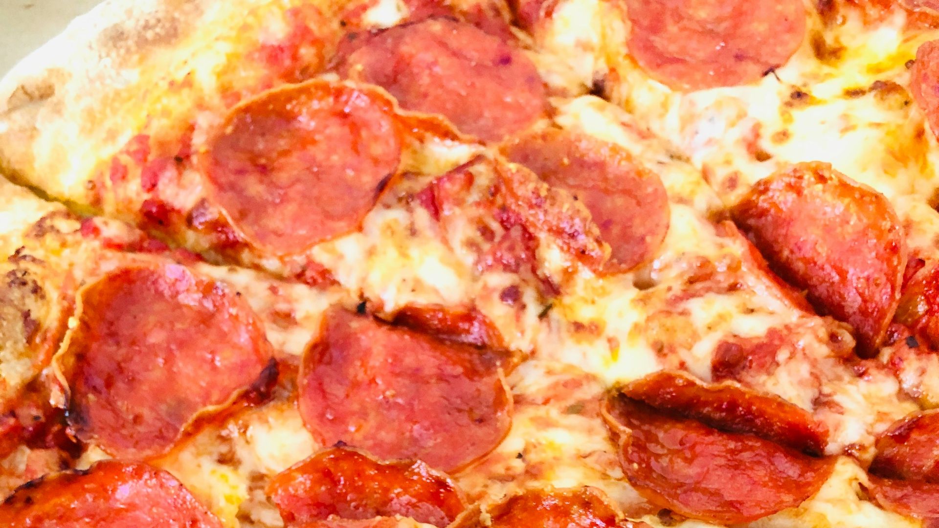 pepperoni pizza on white ceramic plate