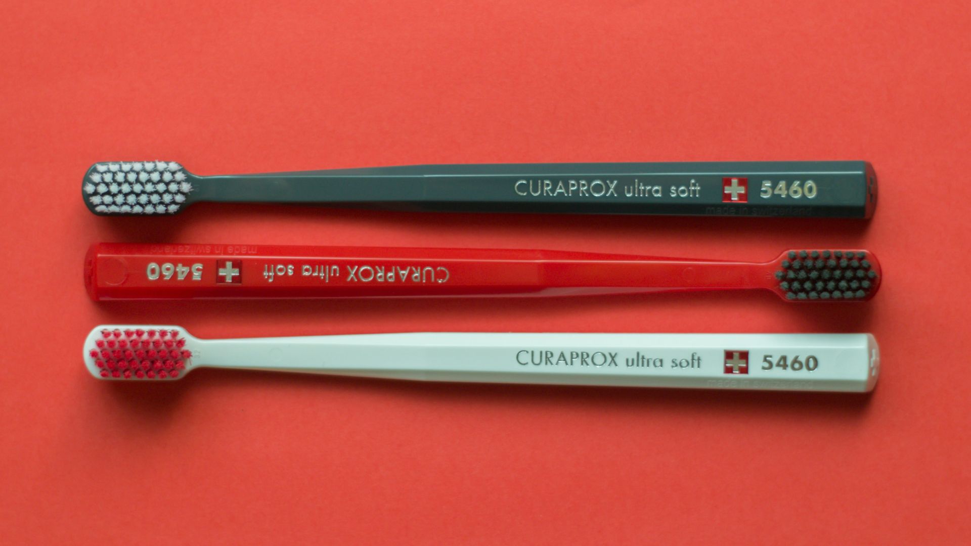 silver and red metal rod