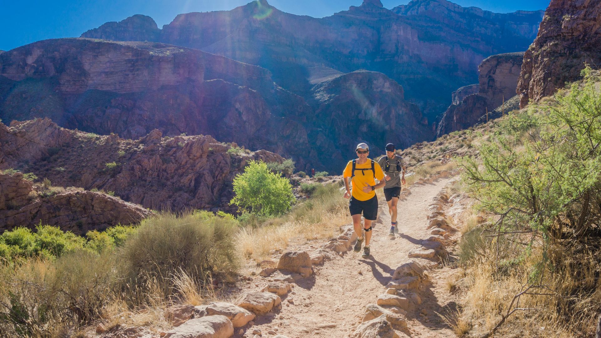 two person running through the field