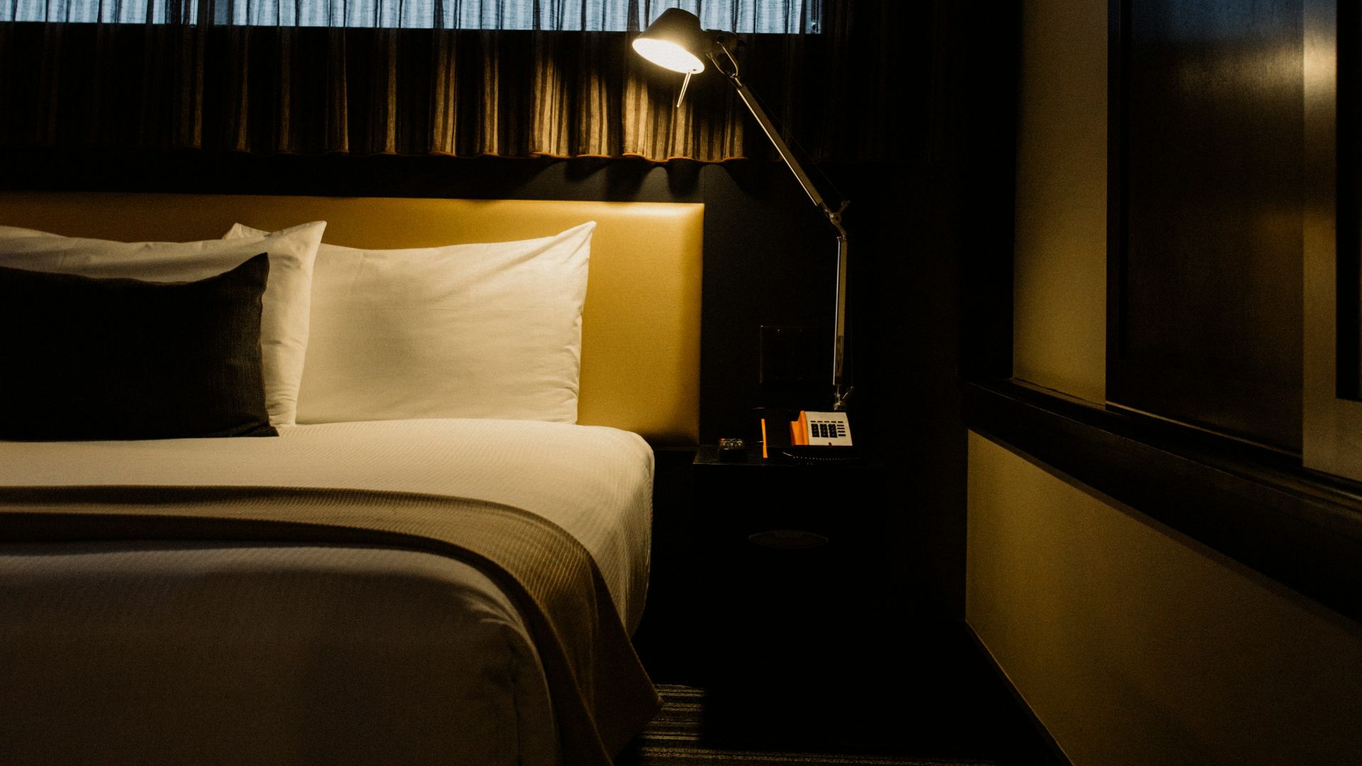 gray table lamp beside bed