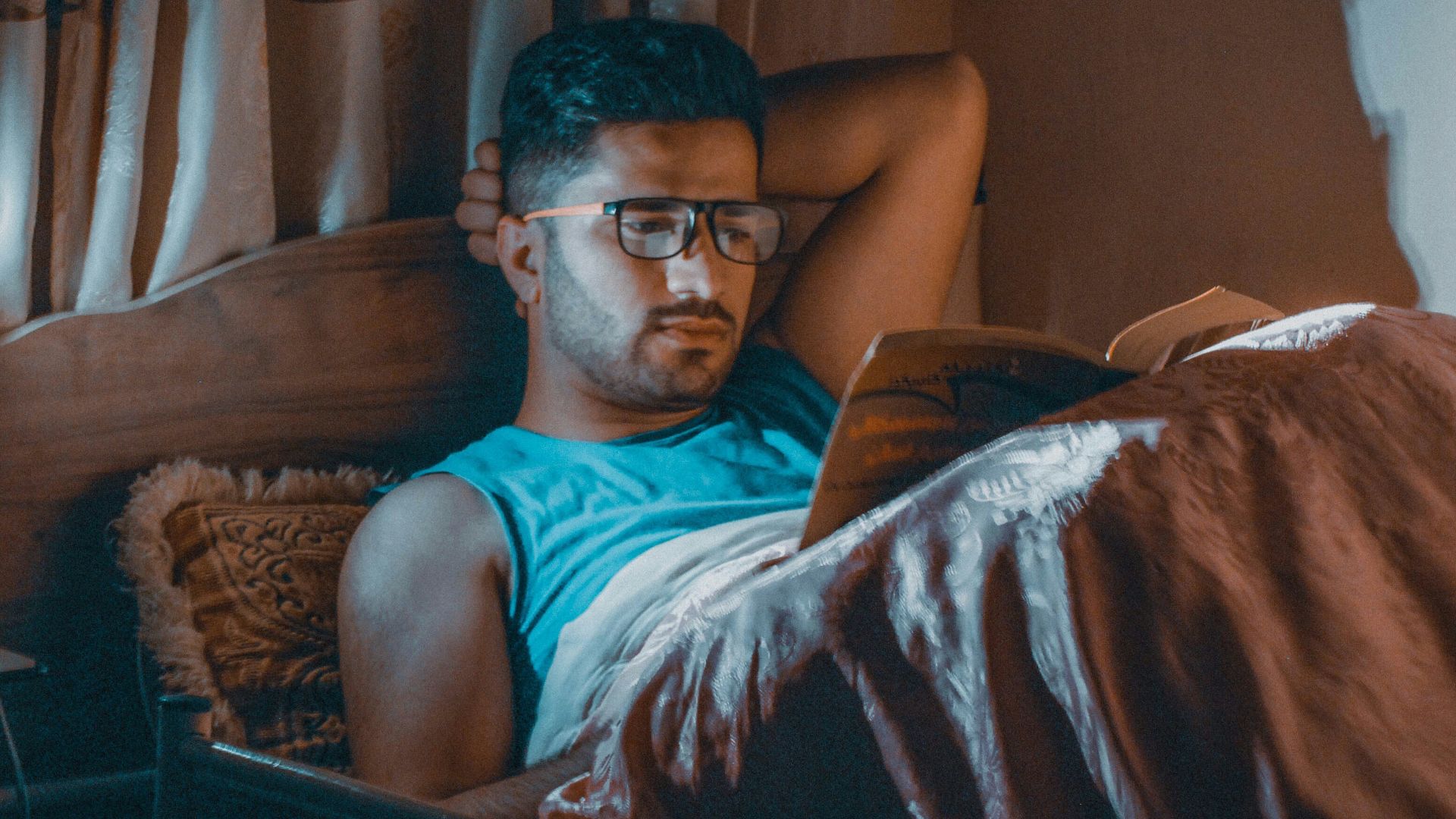 a man sitting in a chair with a laptop