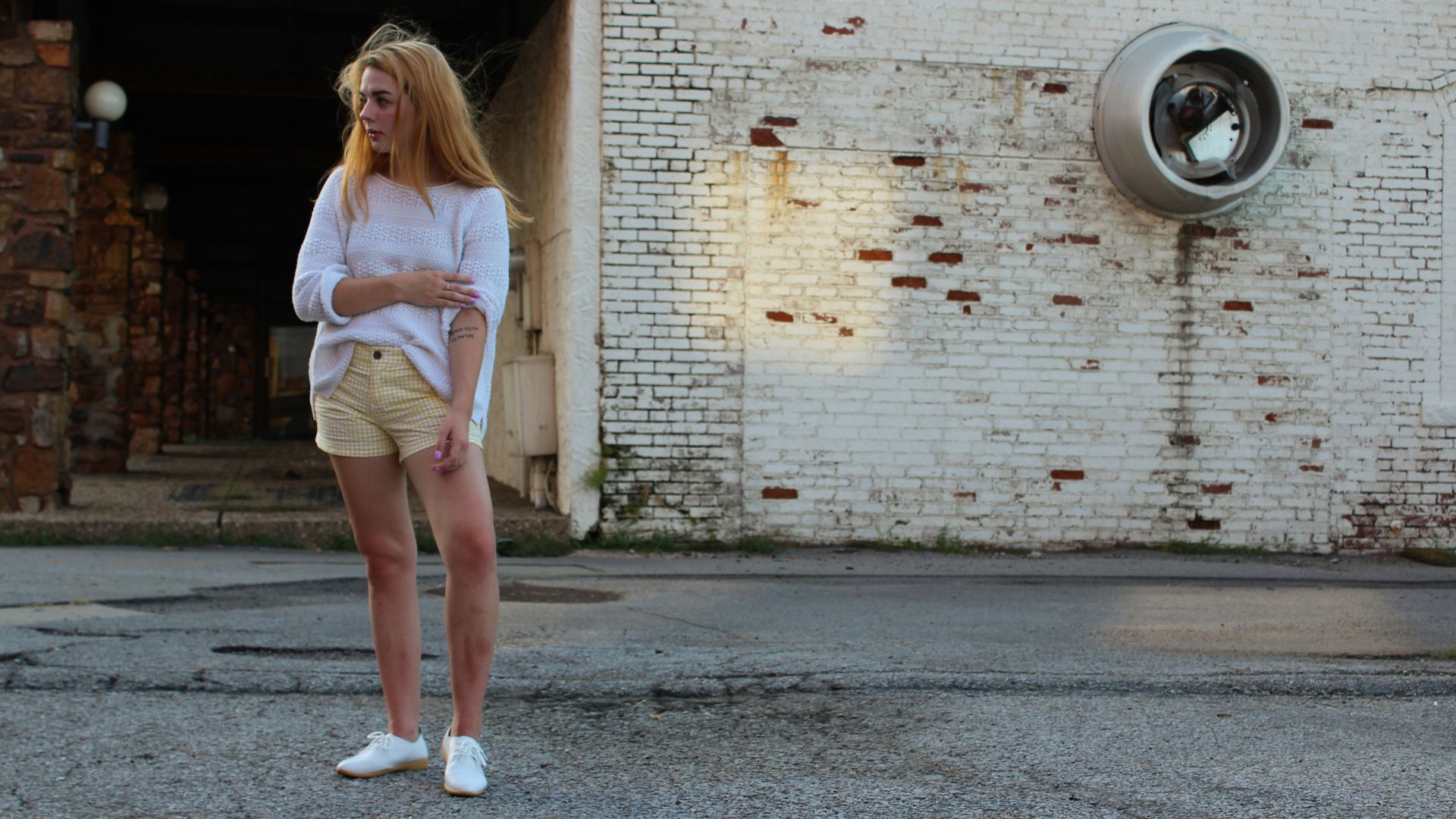 woman standing in front of building