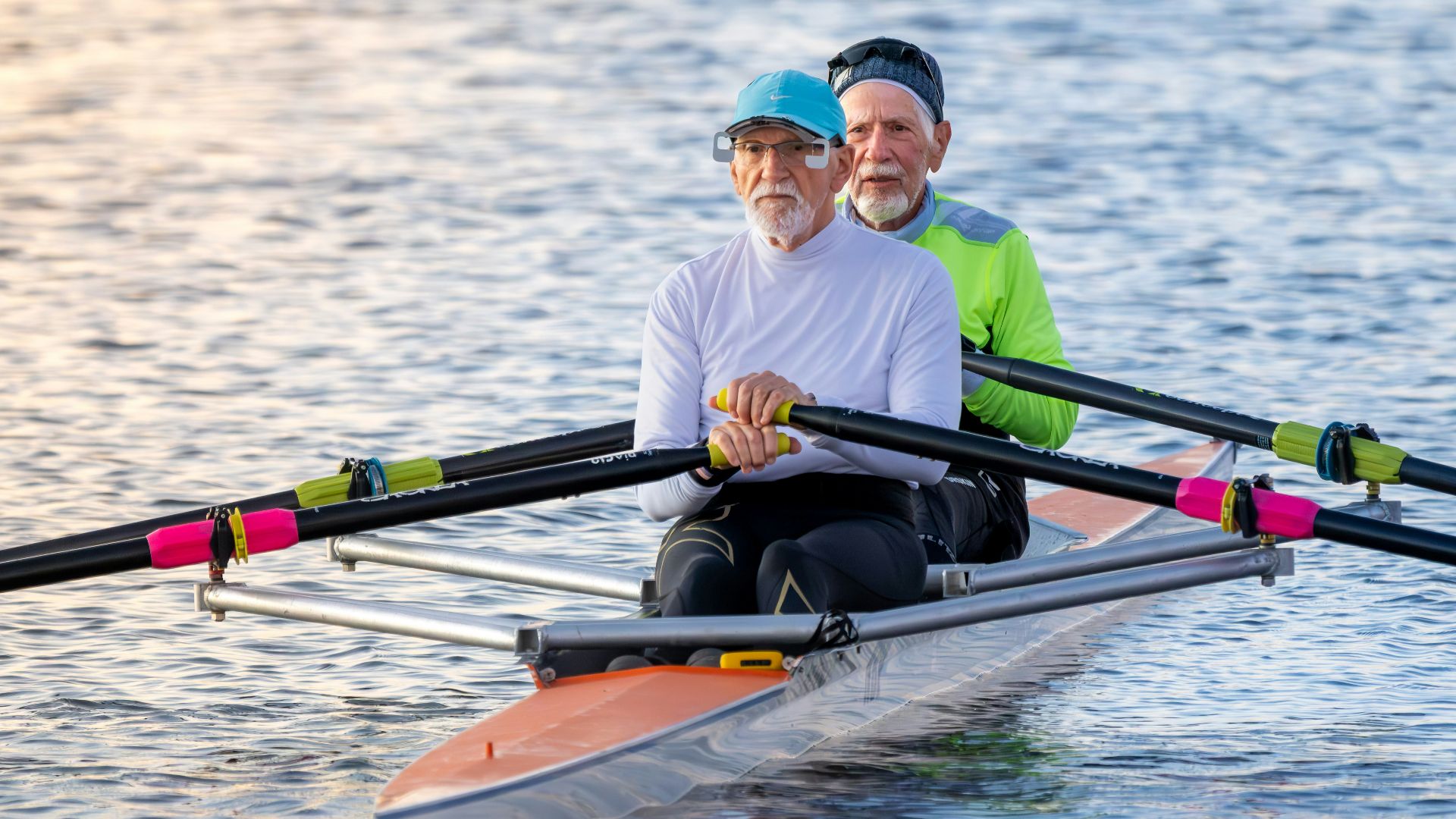 Two people rowing a boat.
