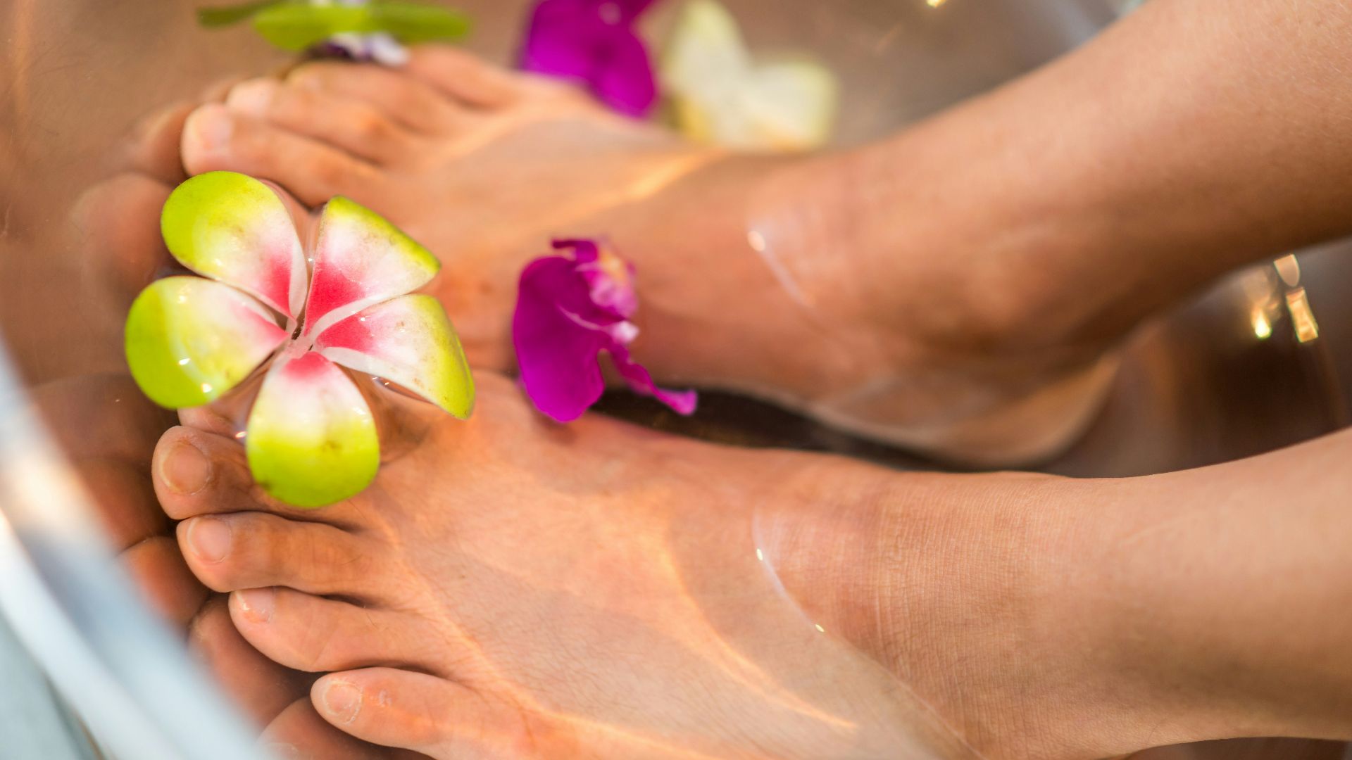 person's feet with flowers