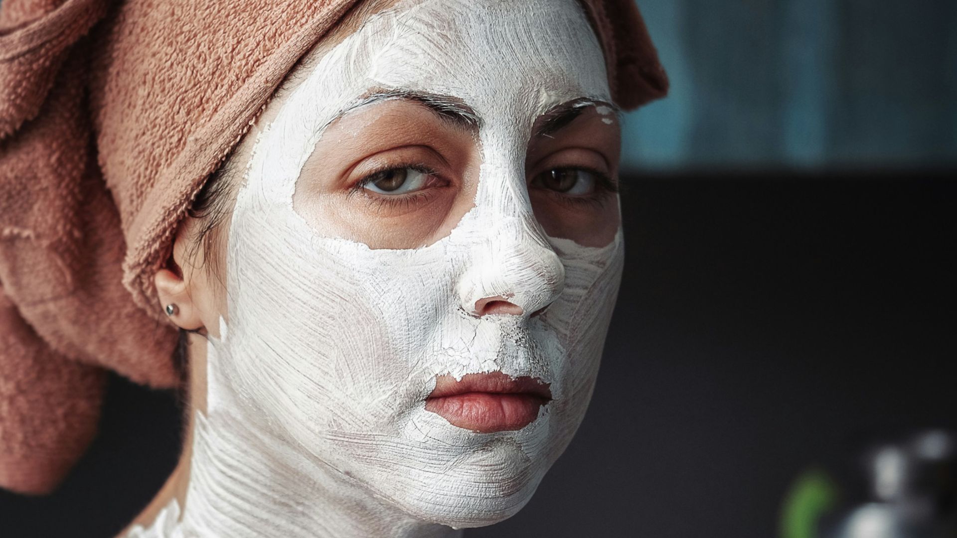 shallow focus photography of woman having a facial