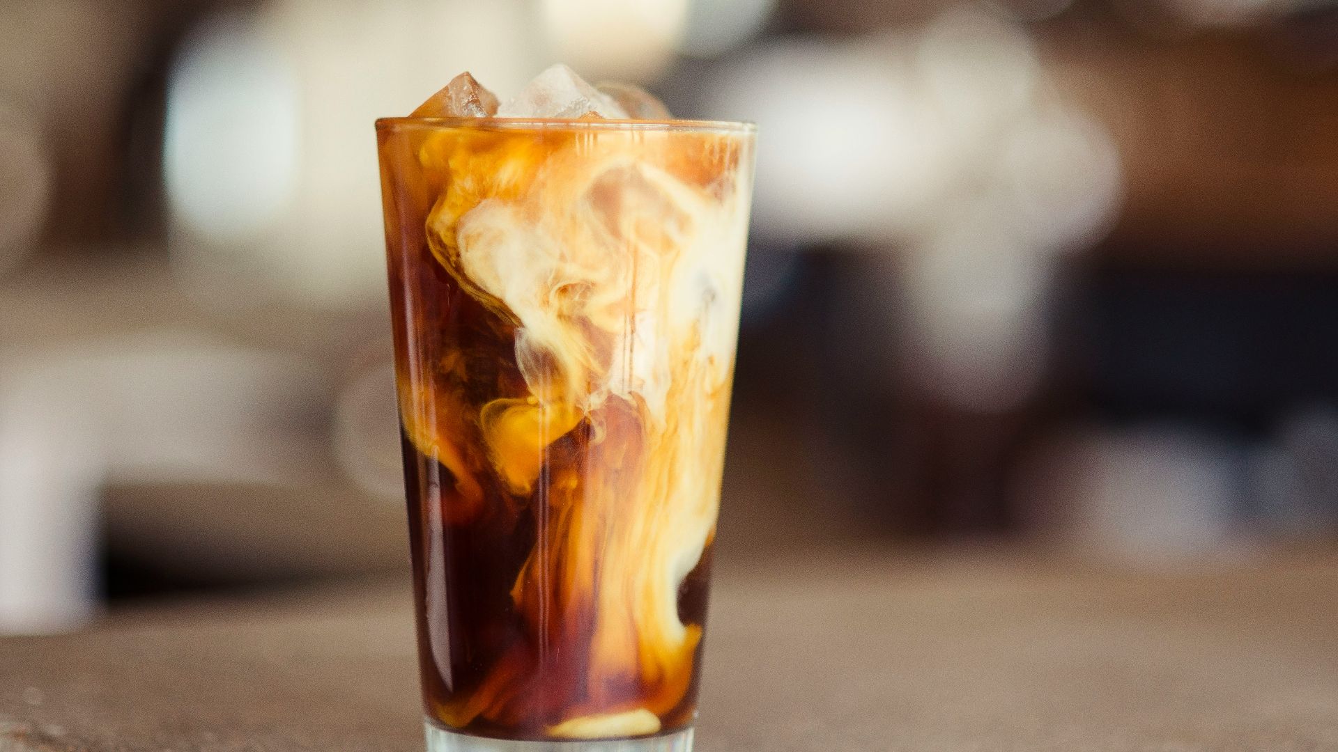 glass cup filled with ice latte on tabletop