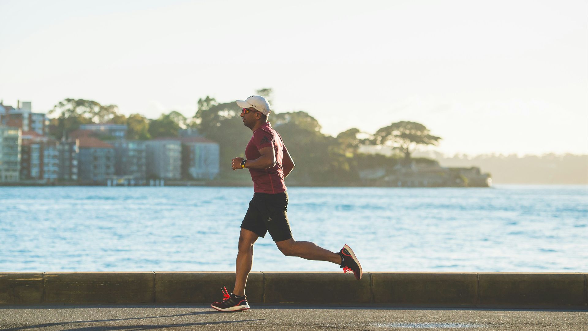 man running near sea during daytime
