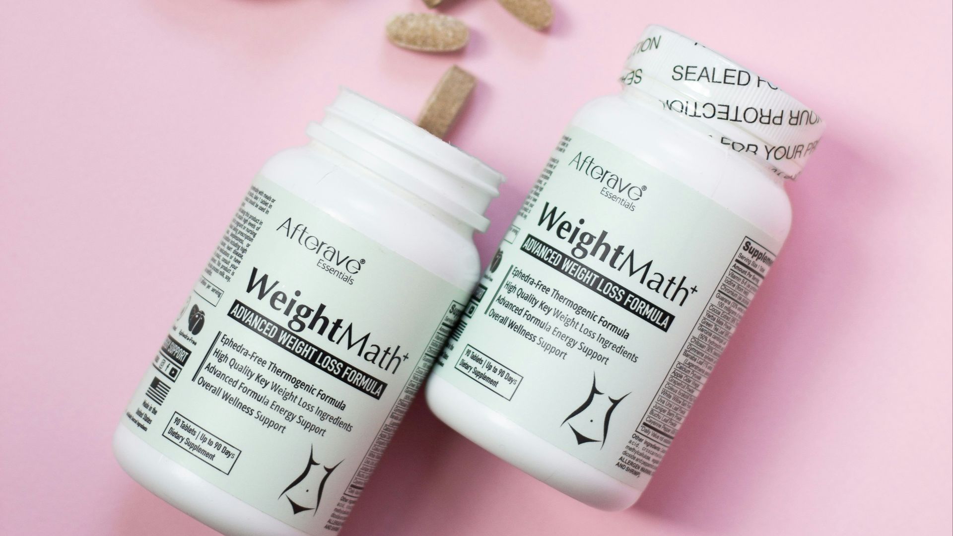 Two bottles of vitamin supplements next to a plant