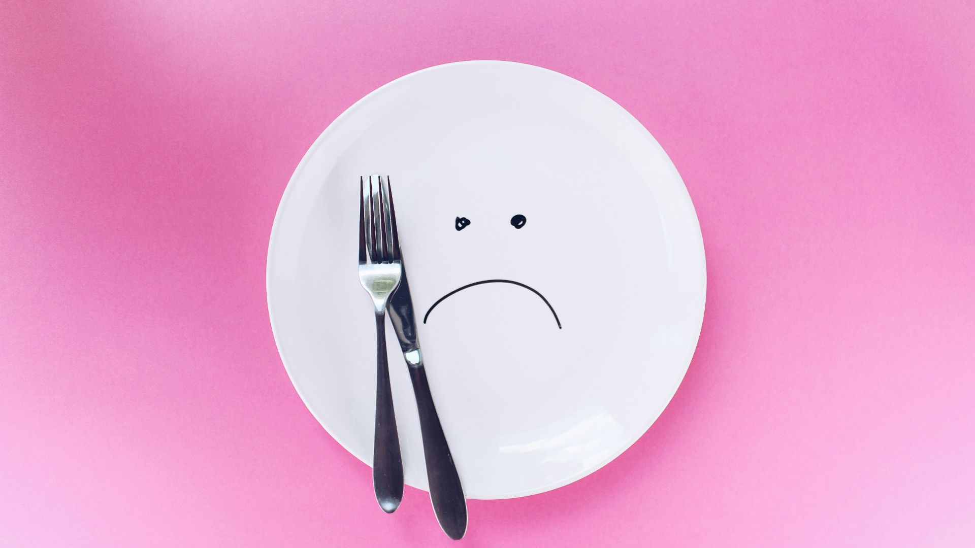 silver fork and knife on plate