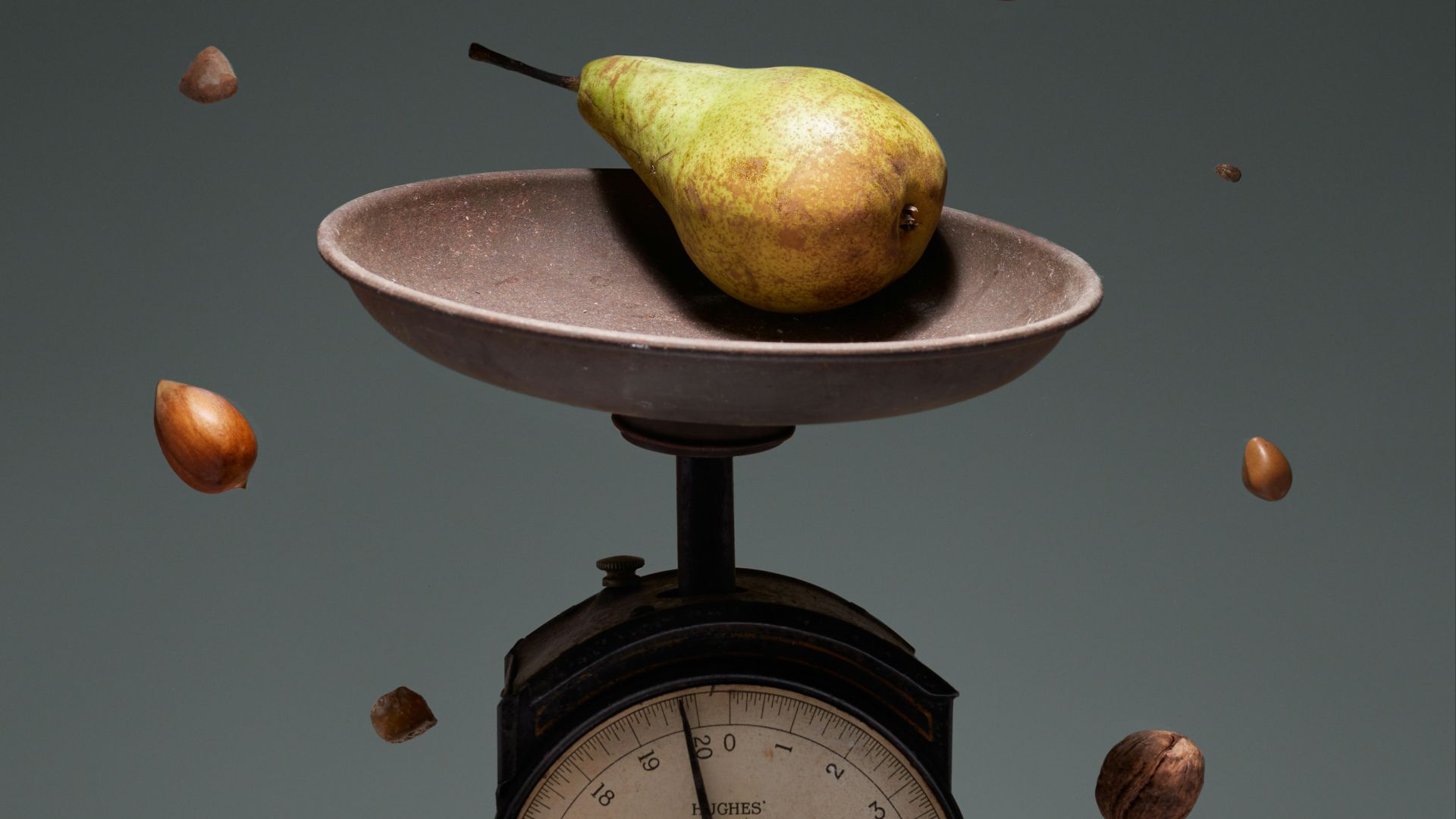 yellow and green fruit on brown weighing scale