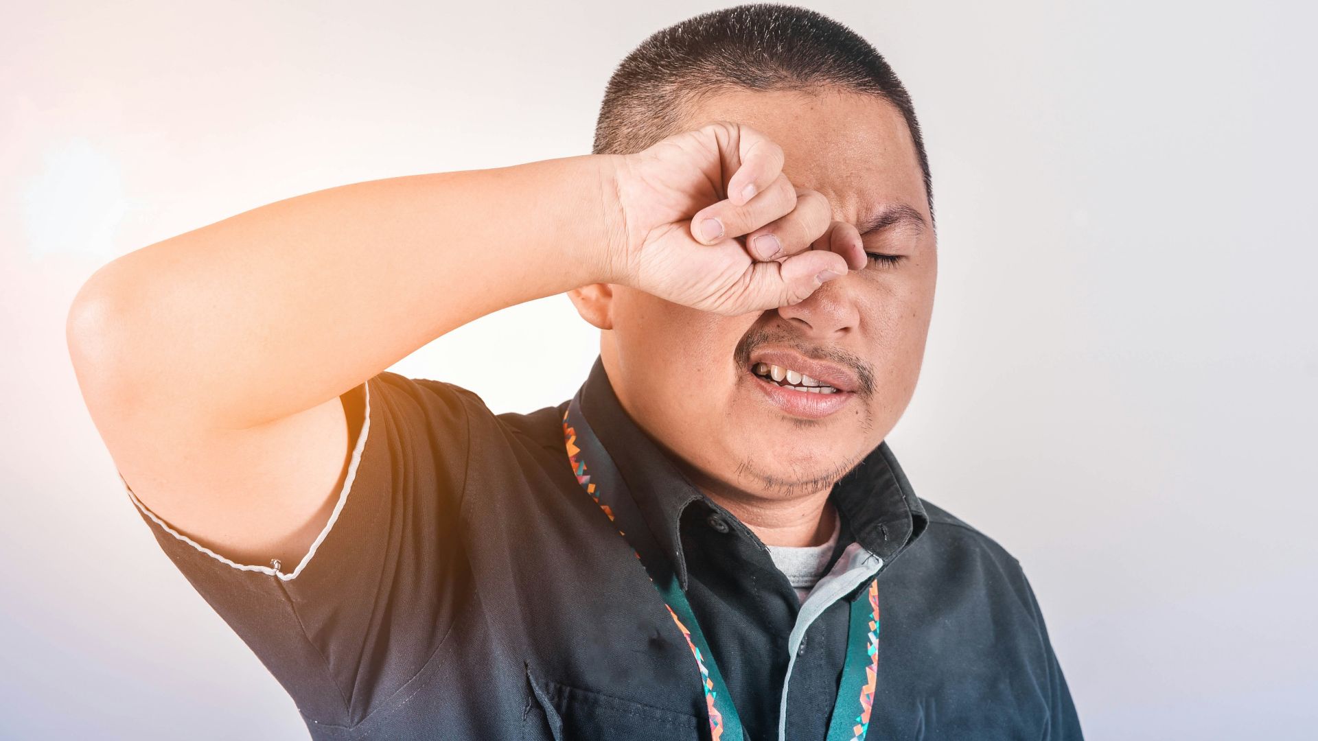 man wearing black collared shirt