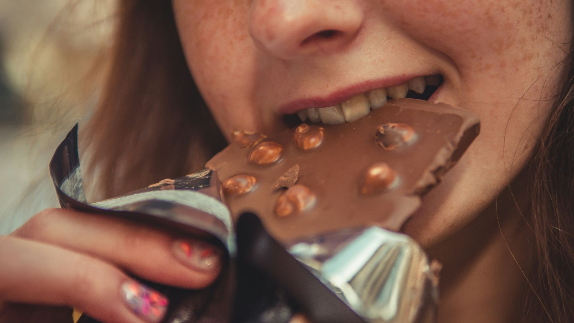 woman eating chocolate