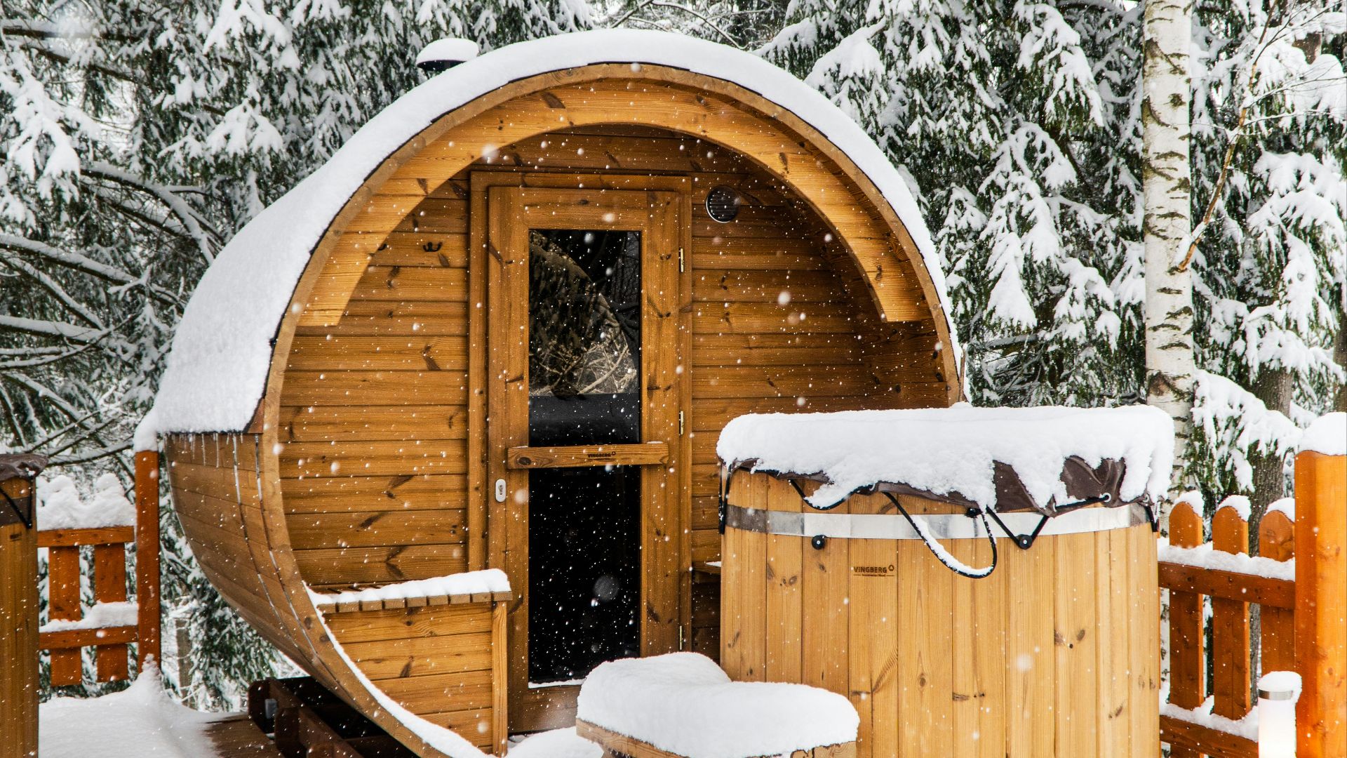 brown wooden house covered with snow