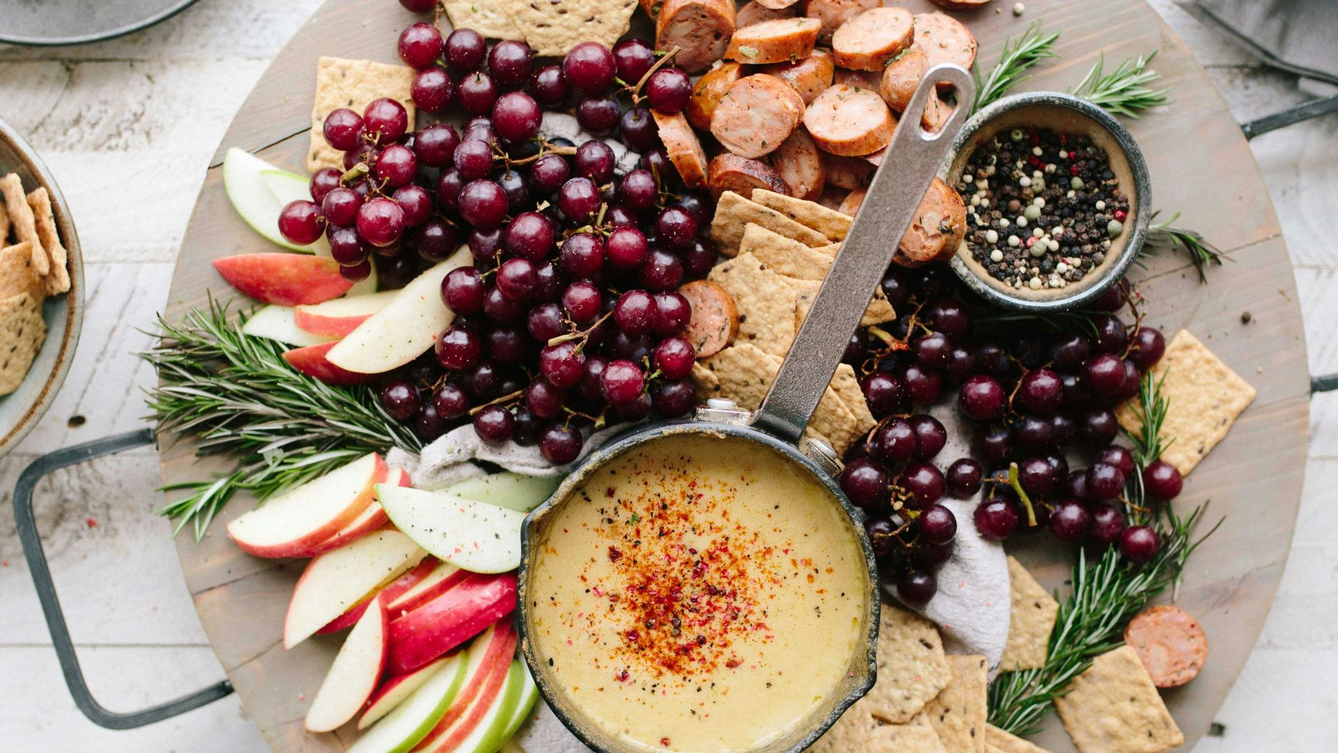 flat lay photography of sliced apples, sausages, chips and brown sauce