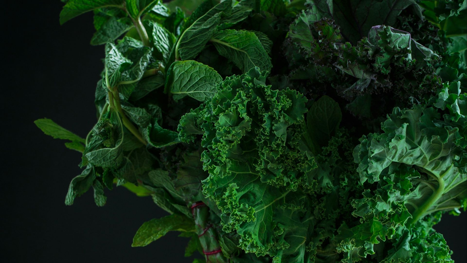 green vegetables on clear glass pitcher