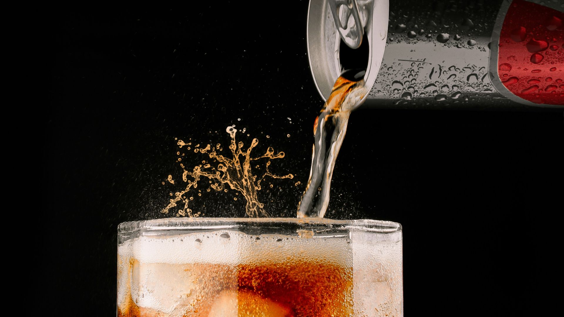 clear drinking glass with brown liquid