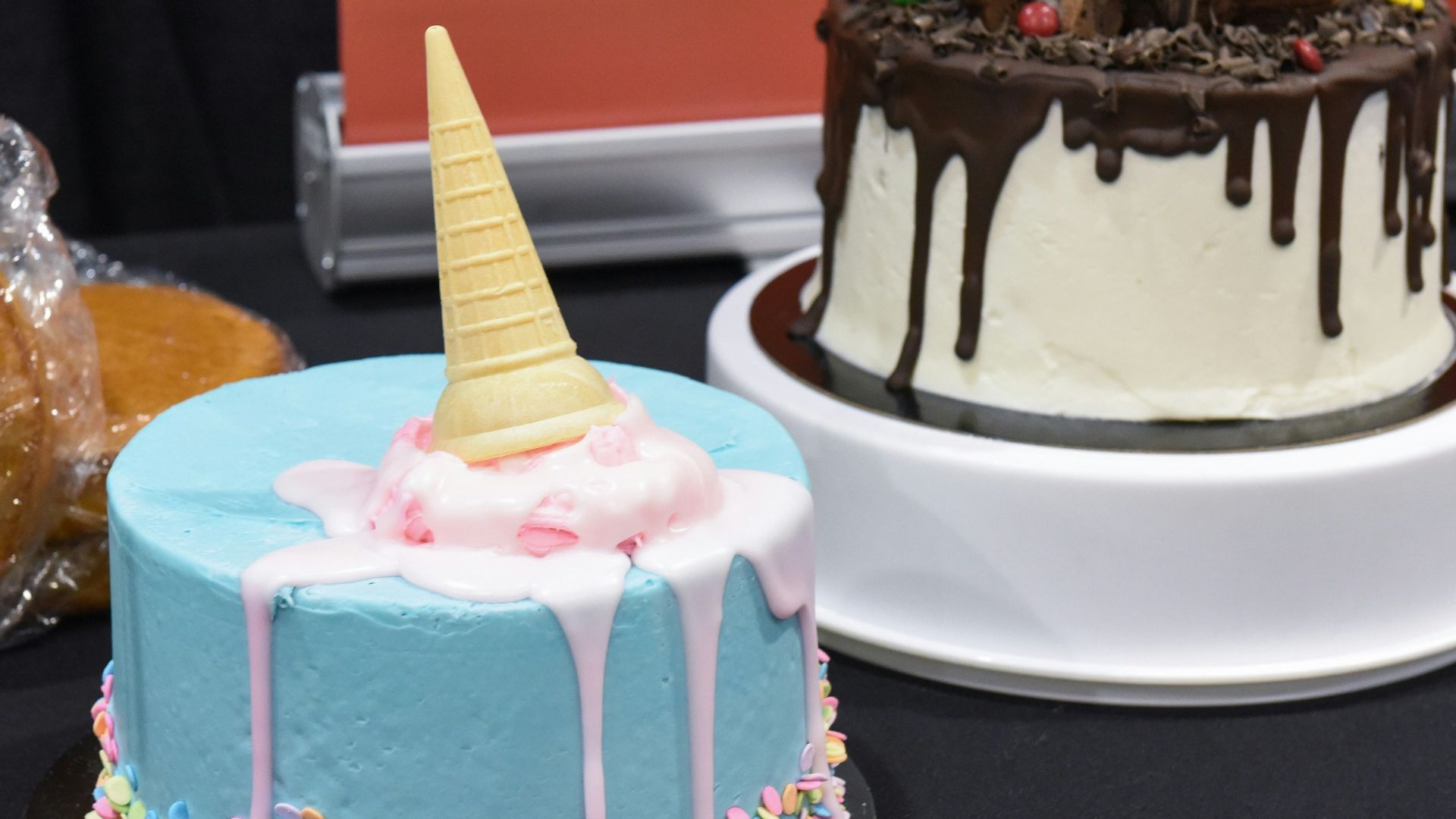a couple of cakes sitting on top of a table