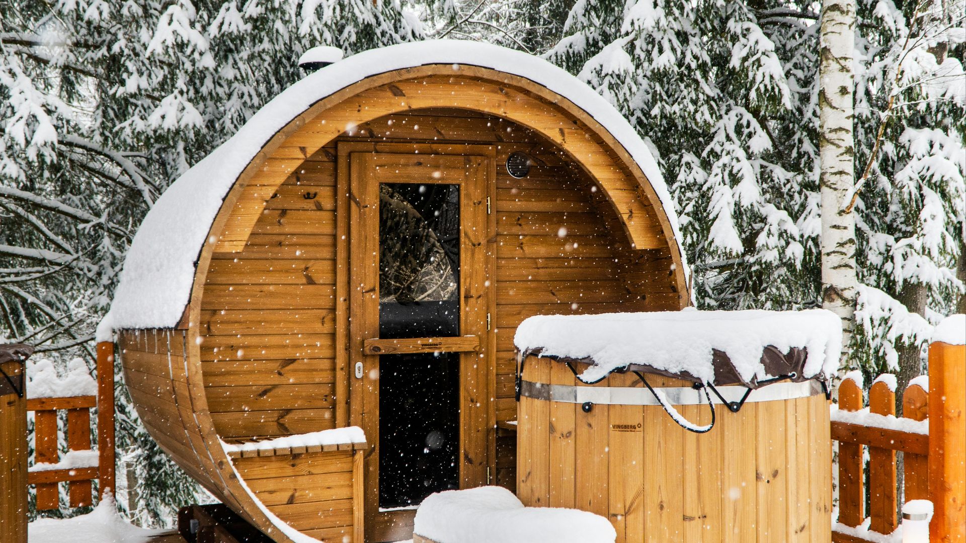 brown wooden house covered with snow