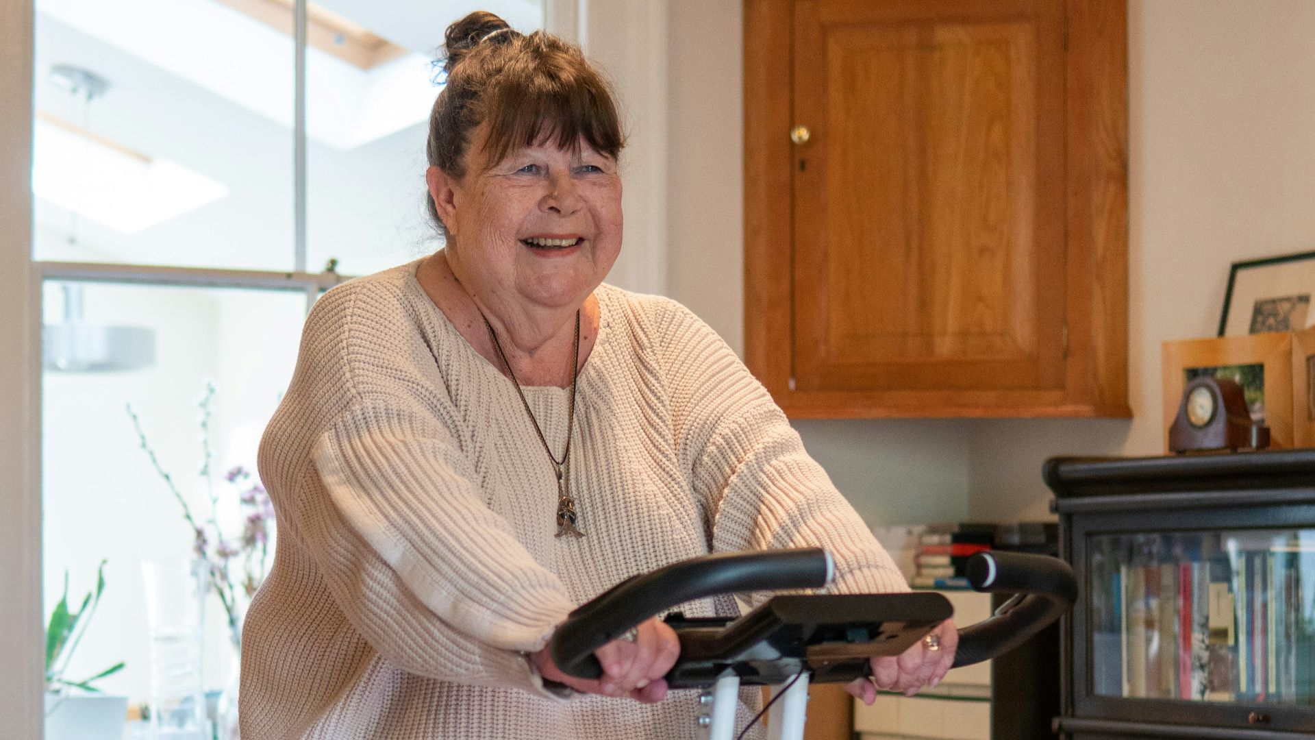 a woman standing on a scooter