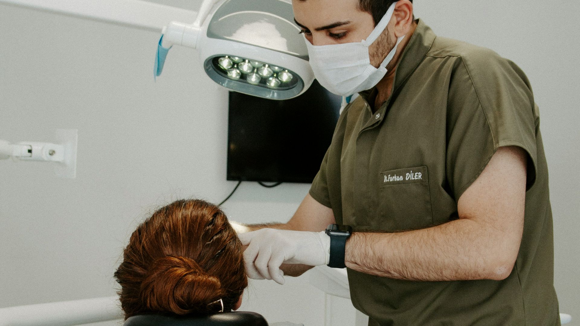 a dentist examining a patient